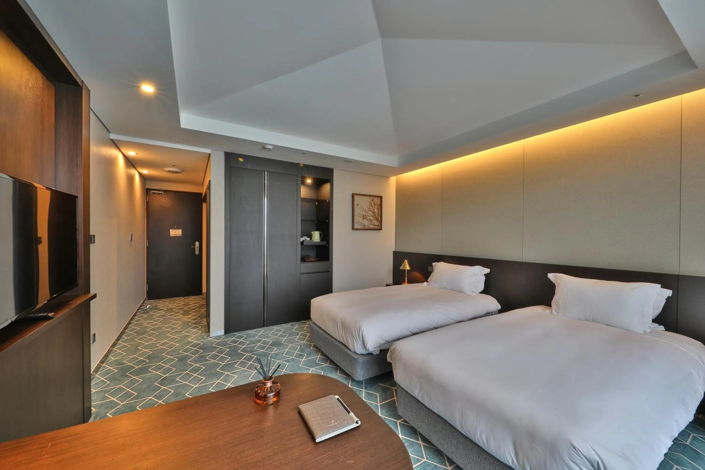 Bed in Camphortree Hotel and Resort