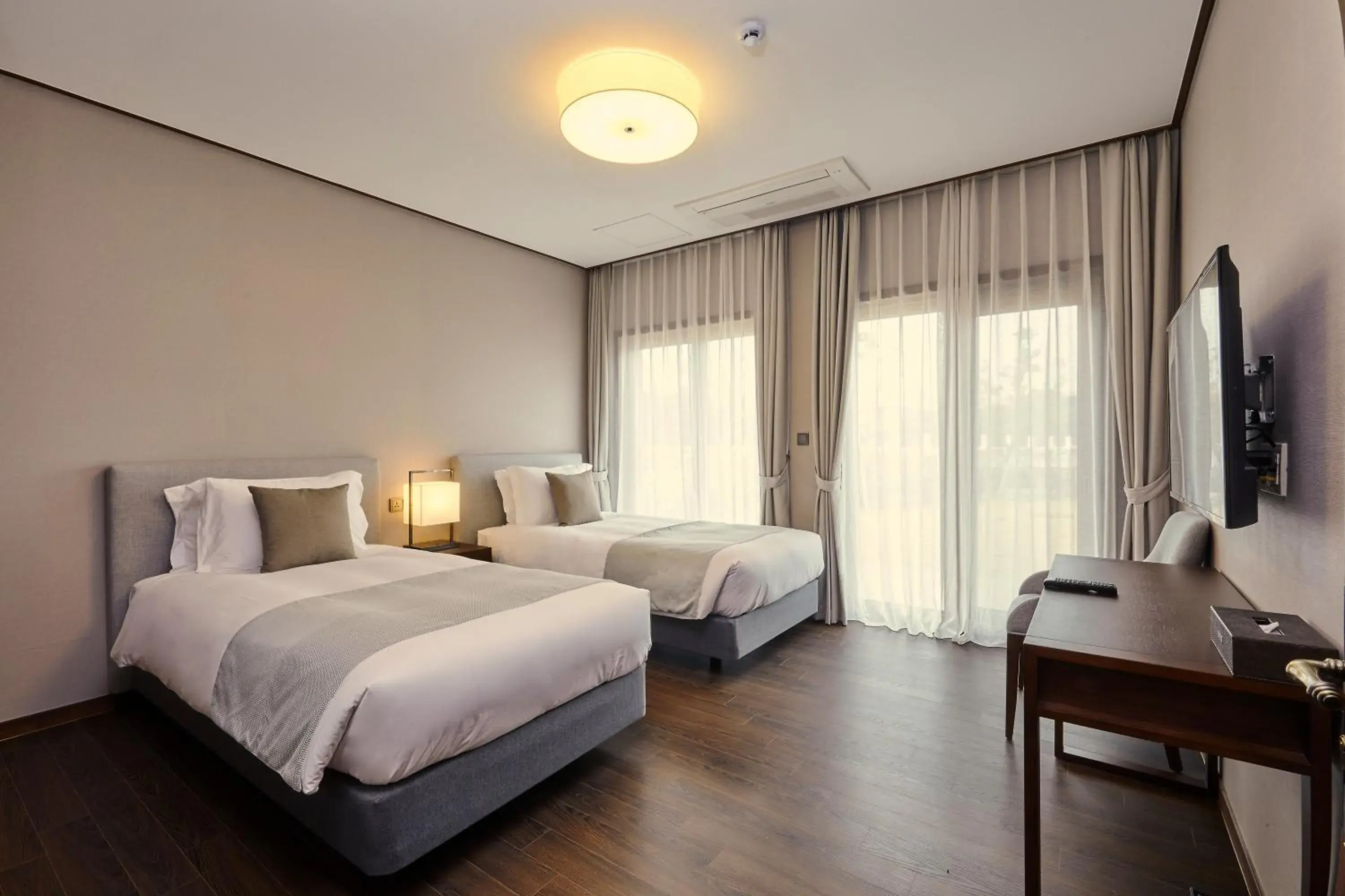 Bed in Camphortree Hotel and Resort Bed in Camphortree Hotel and Resort