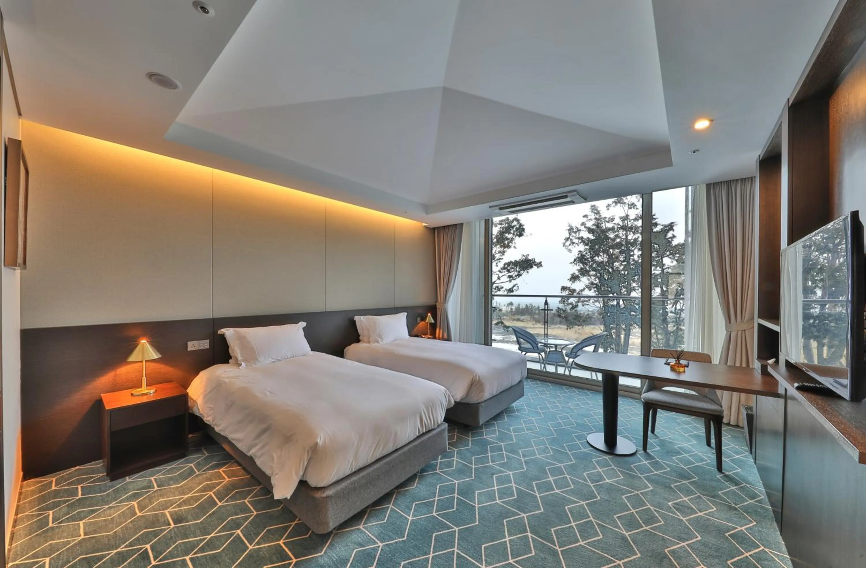 Bed in Camphortree Hotel and Resort