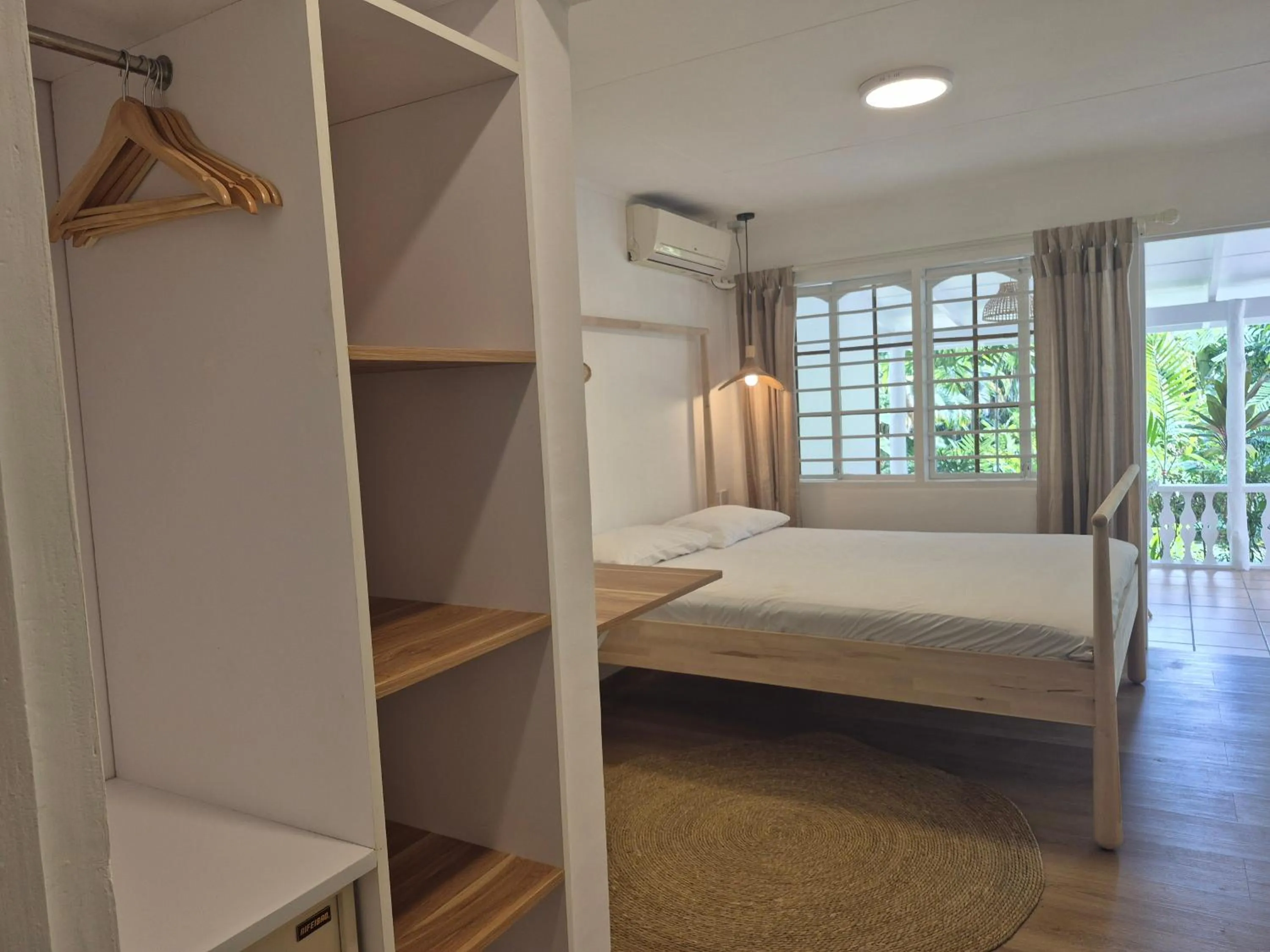 Bed in Beau Vallon Bungalows