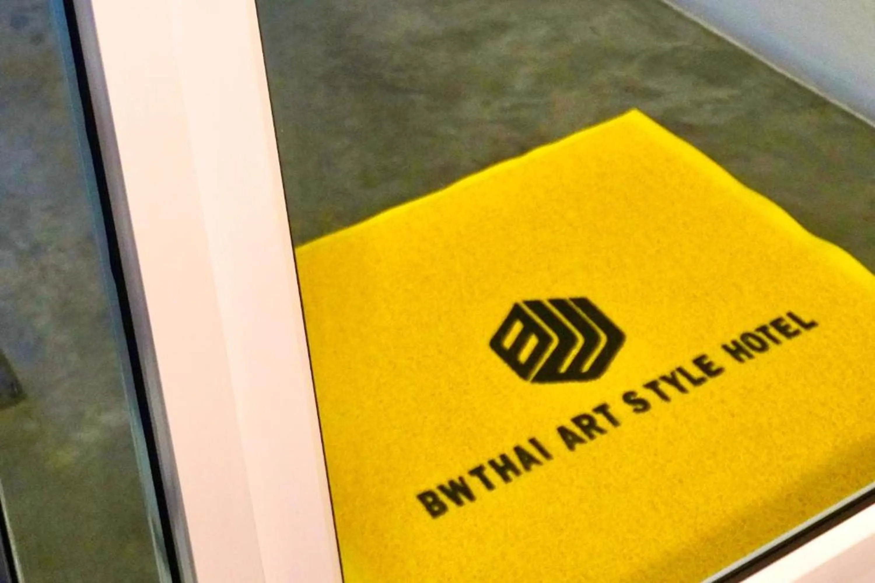 Text overlay in BW Thai Art Style Hotel