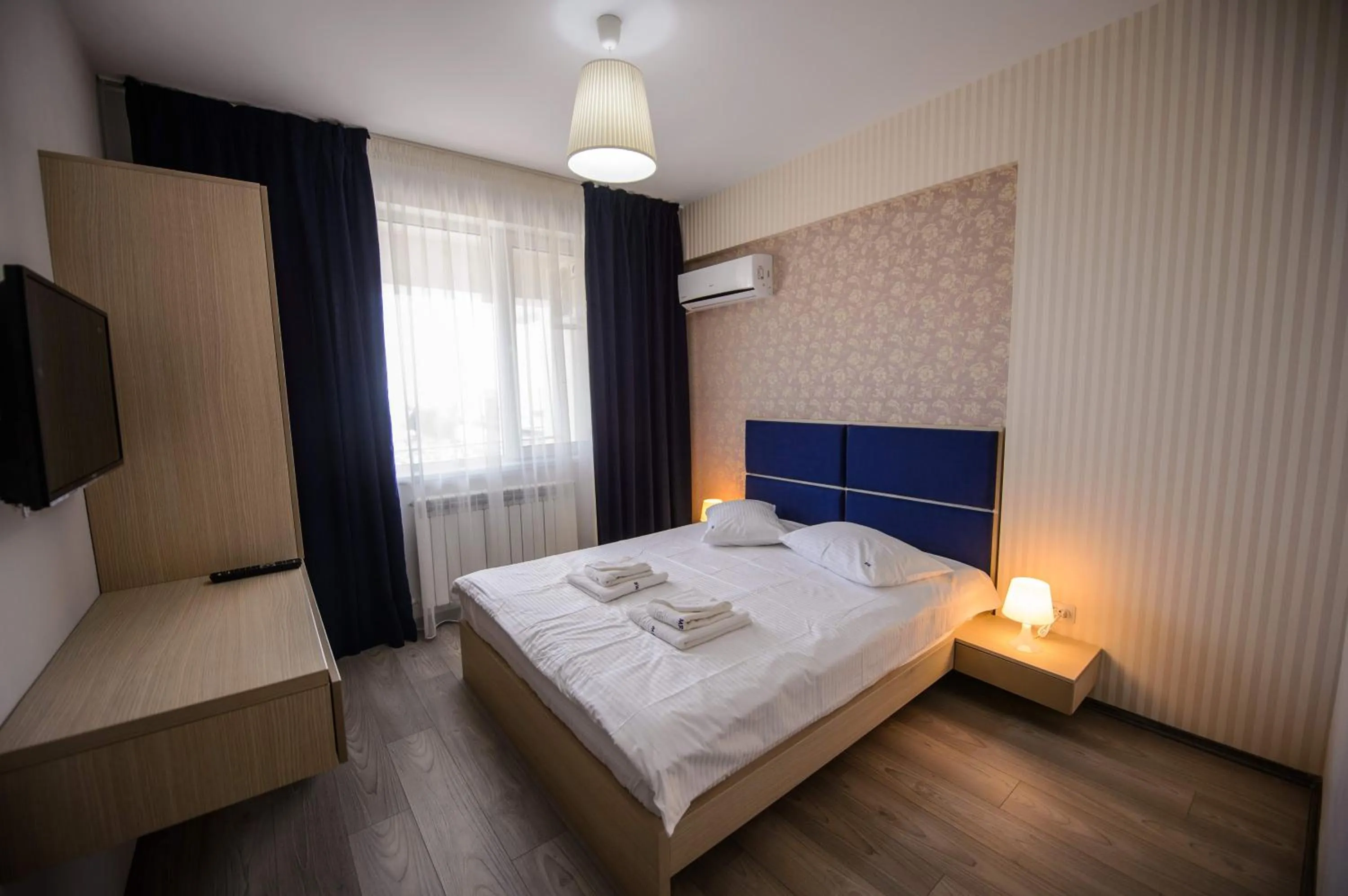 Photo of the whole room, Bed in Magnum Residence