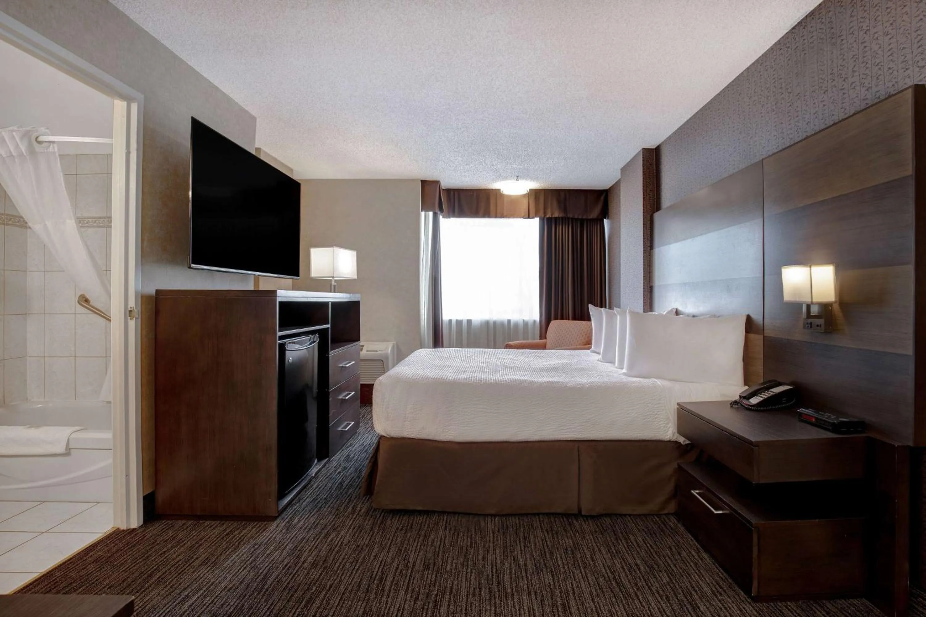 Photo of the whole room, Bed in Days Inn by Wyndham Calgary South