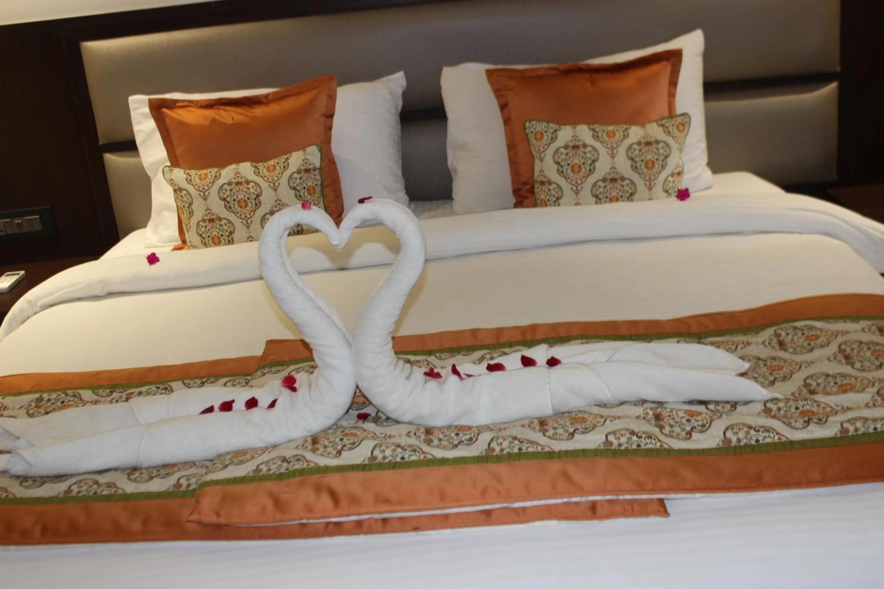 Bed in Ramya Resort & Spa