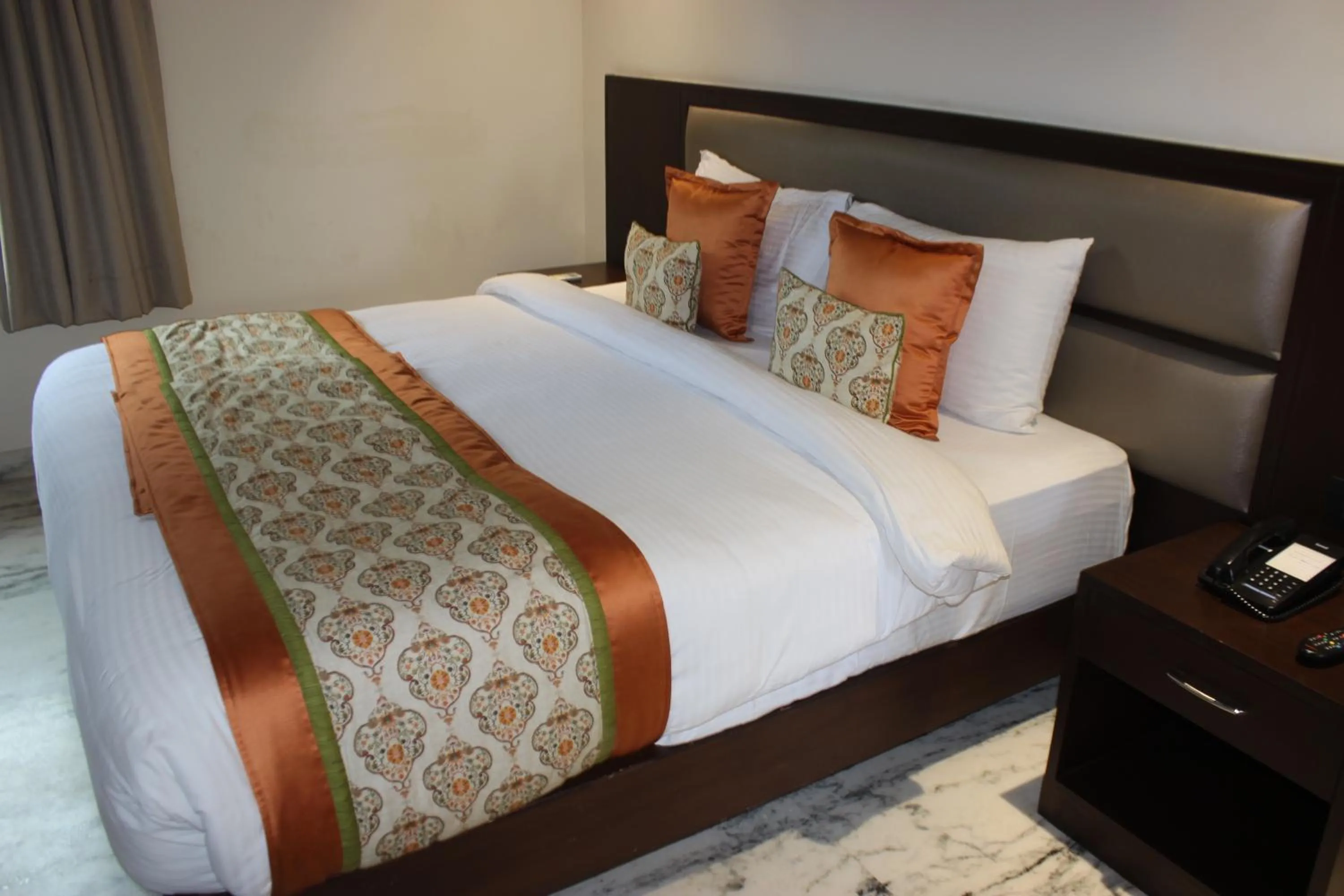 Bed in Ramya Resort & Spa
