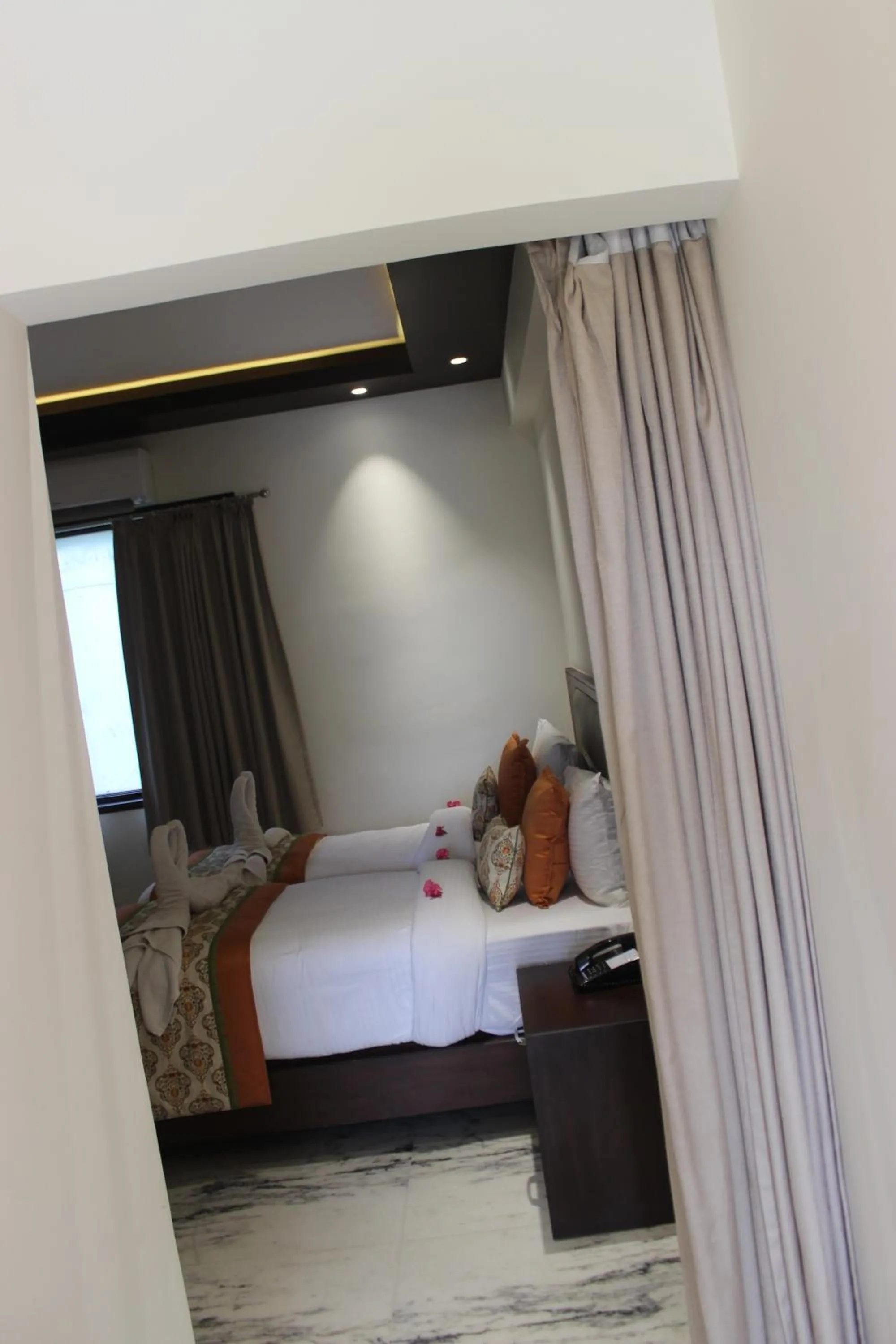 Bed in Ramya Resort & Spa