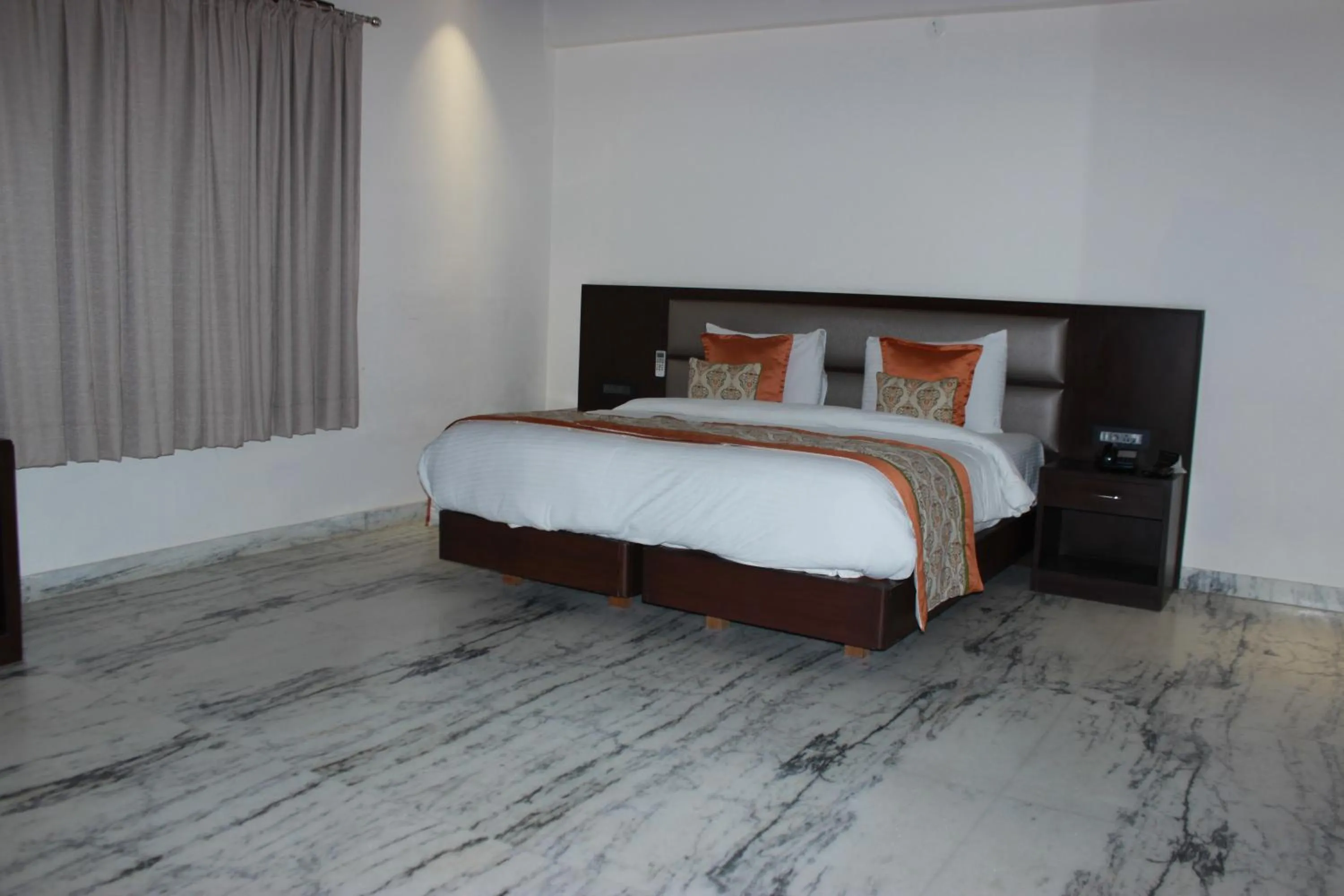 Bed in Ramya Resort & Spa