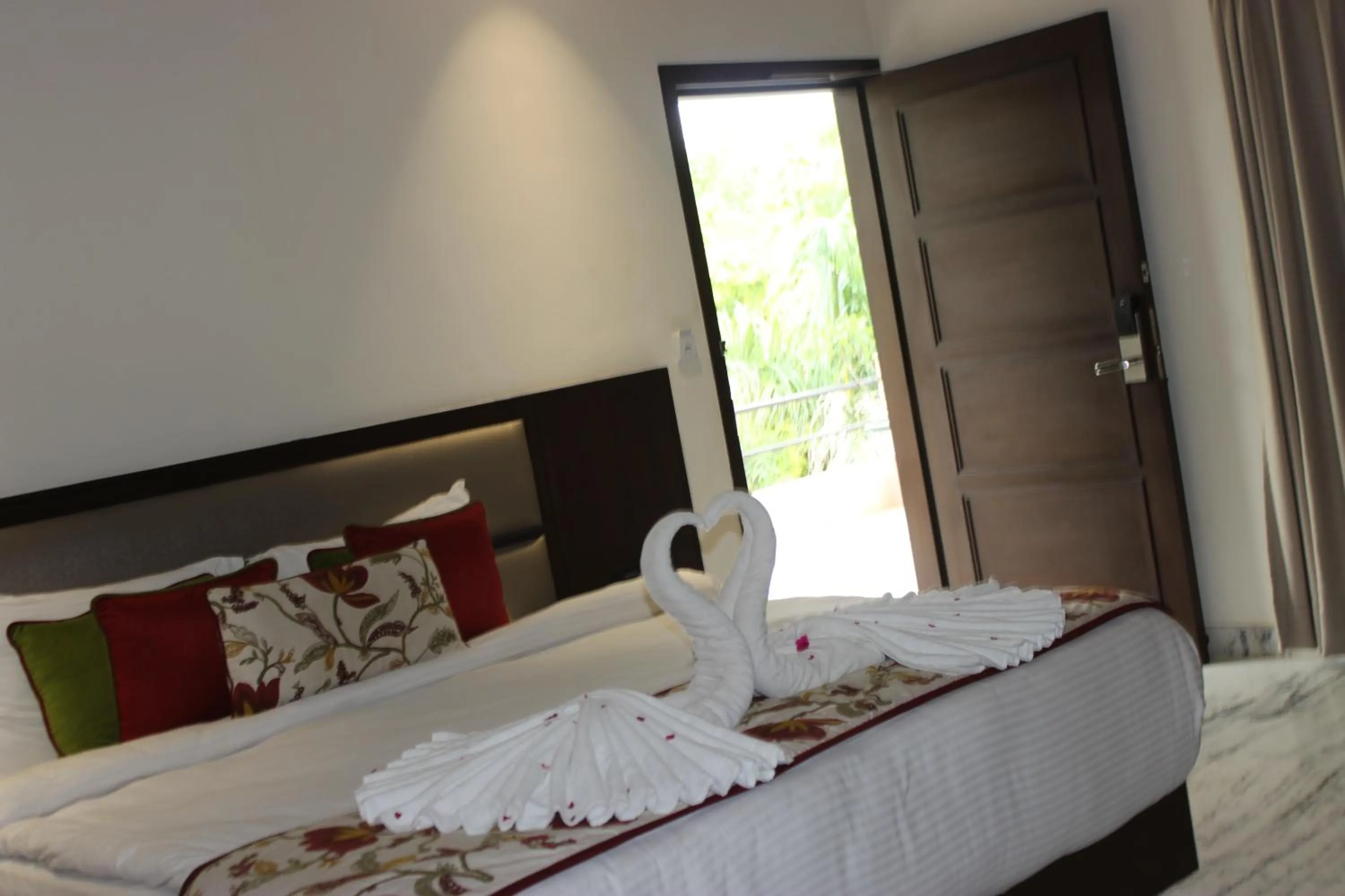 Bed in Ramya Resort & Spa