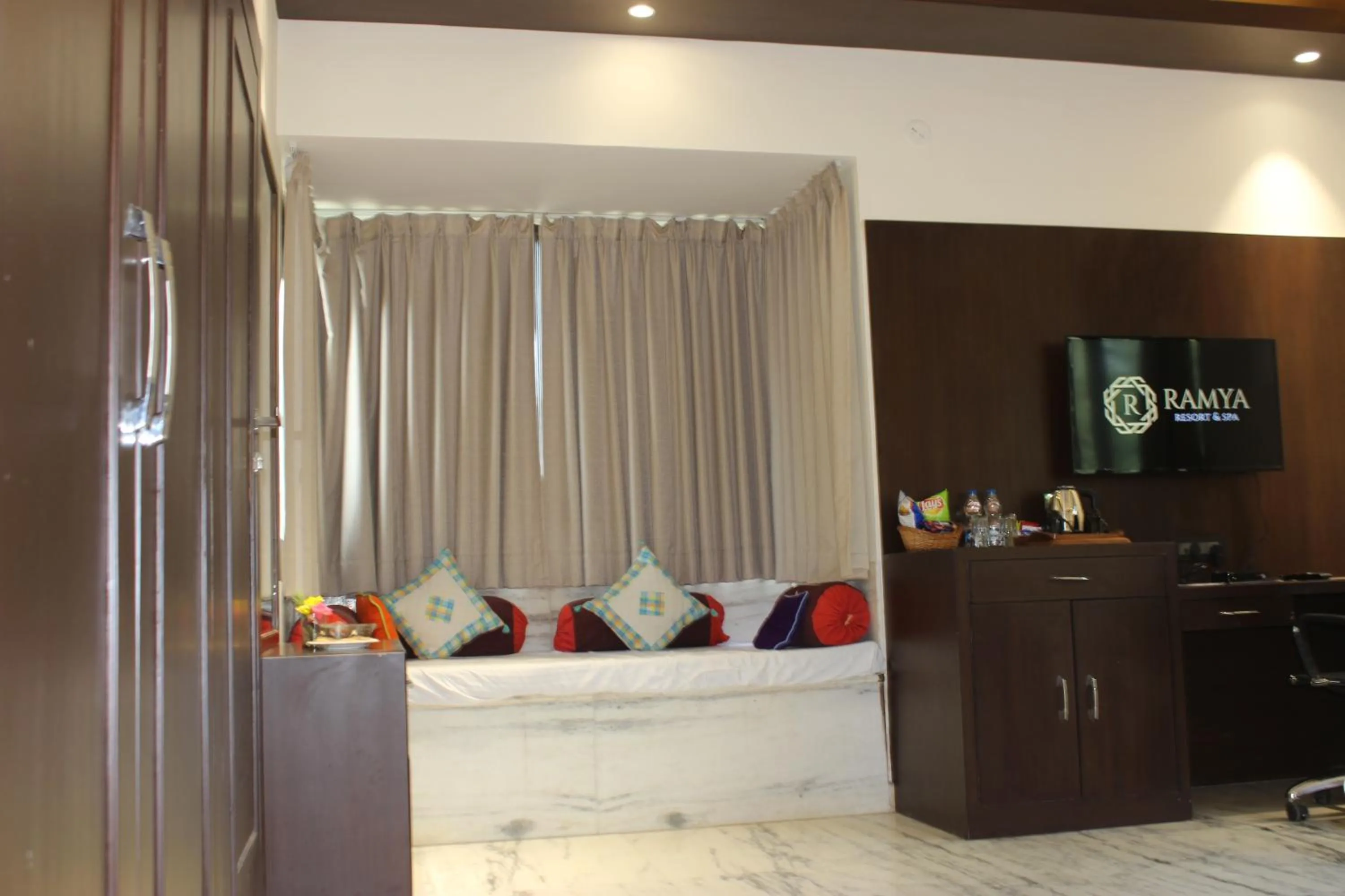 Bed in Ramya Resort & Spa