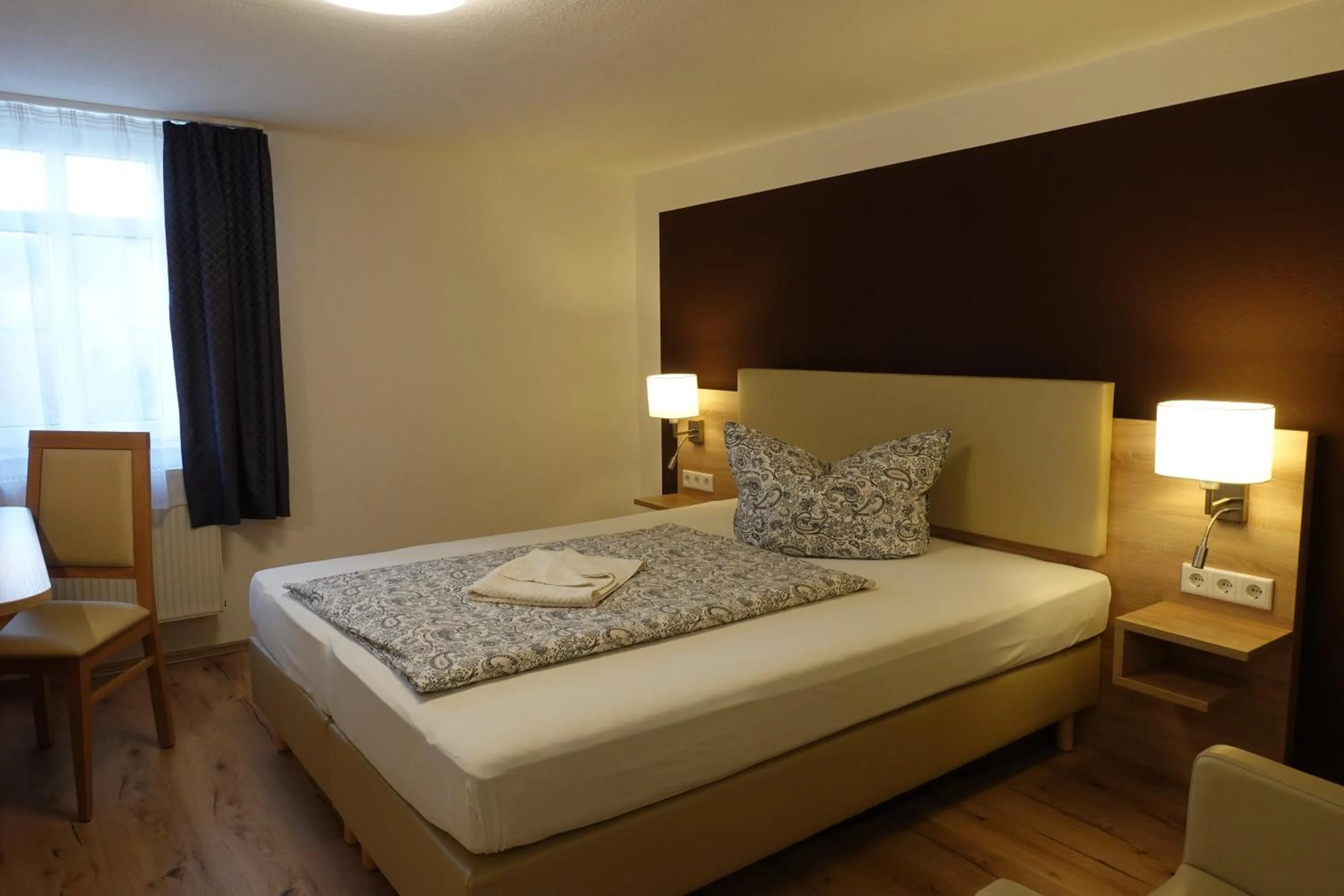 Bed in Hotel Maximilian