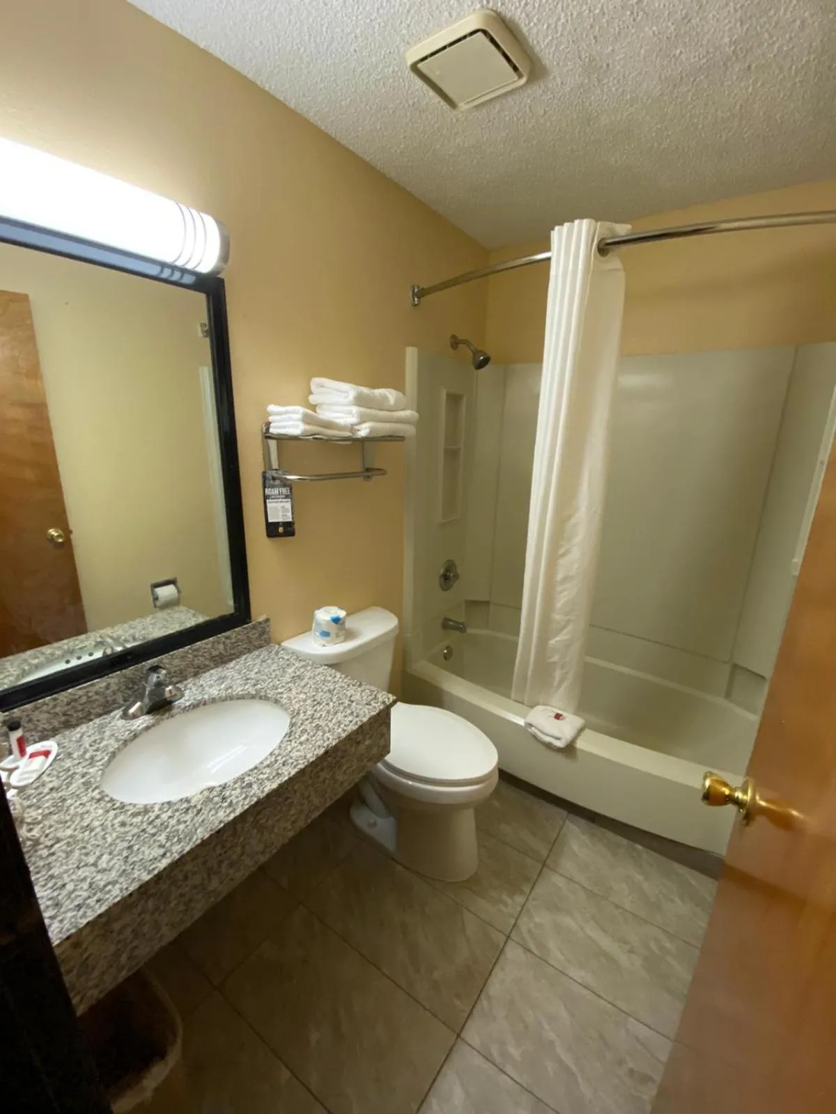 Bathroom in Super 8 by Wyndham Kansas City at Barry Road/Airport