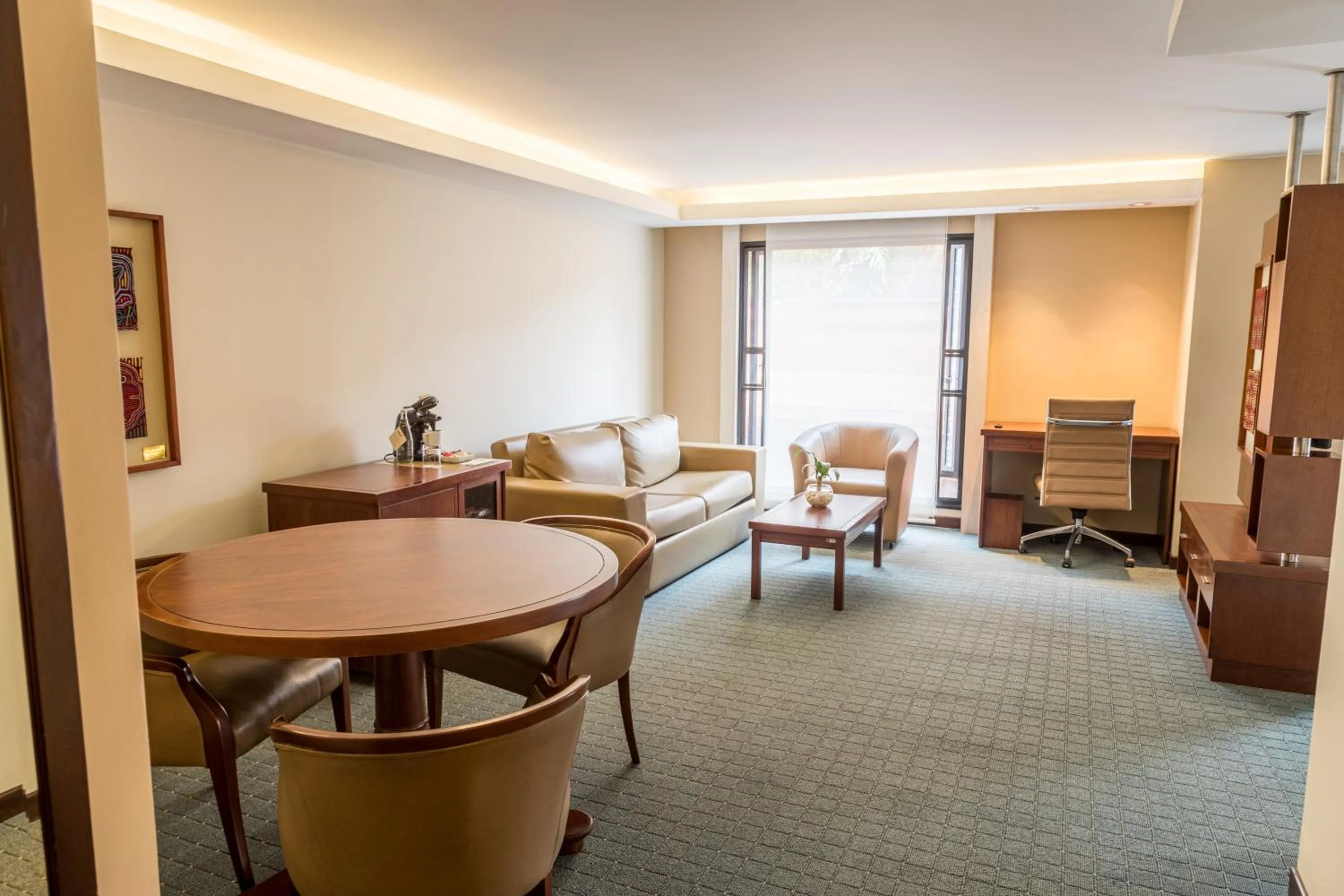 Living room in GHL Hotel Capital