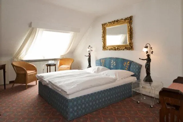 Bed in Hotel Behrmann