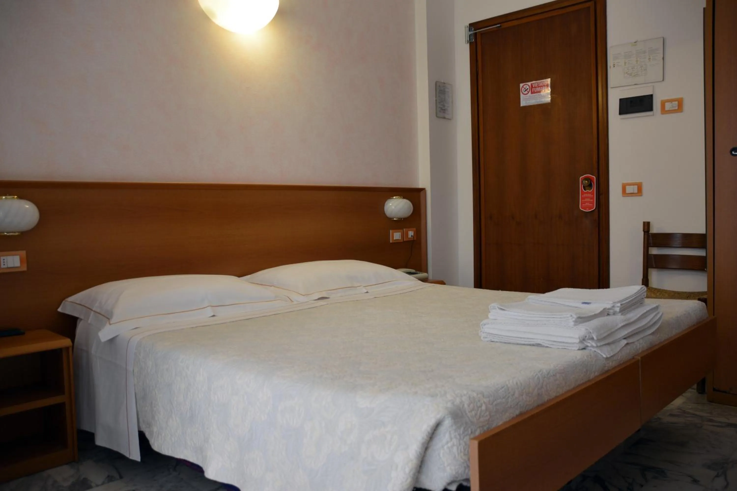 Bed in Hotel Corallo