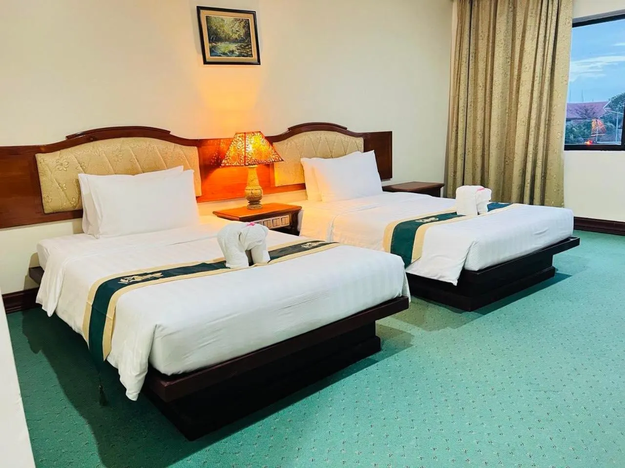 Bed in Dragon Royal Angkor Hotel