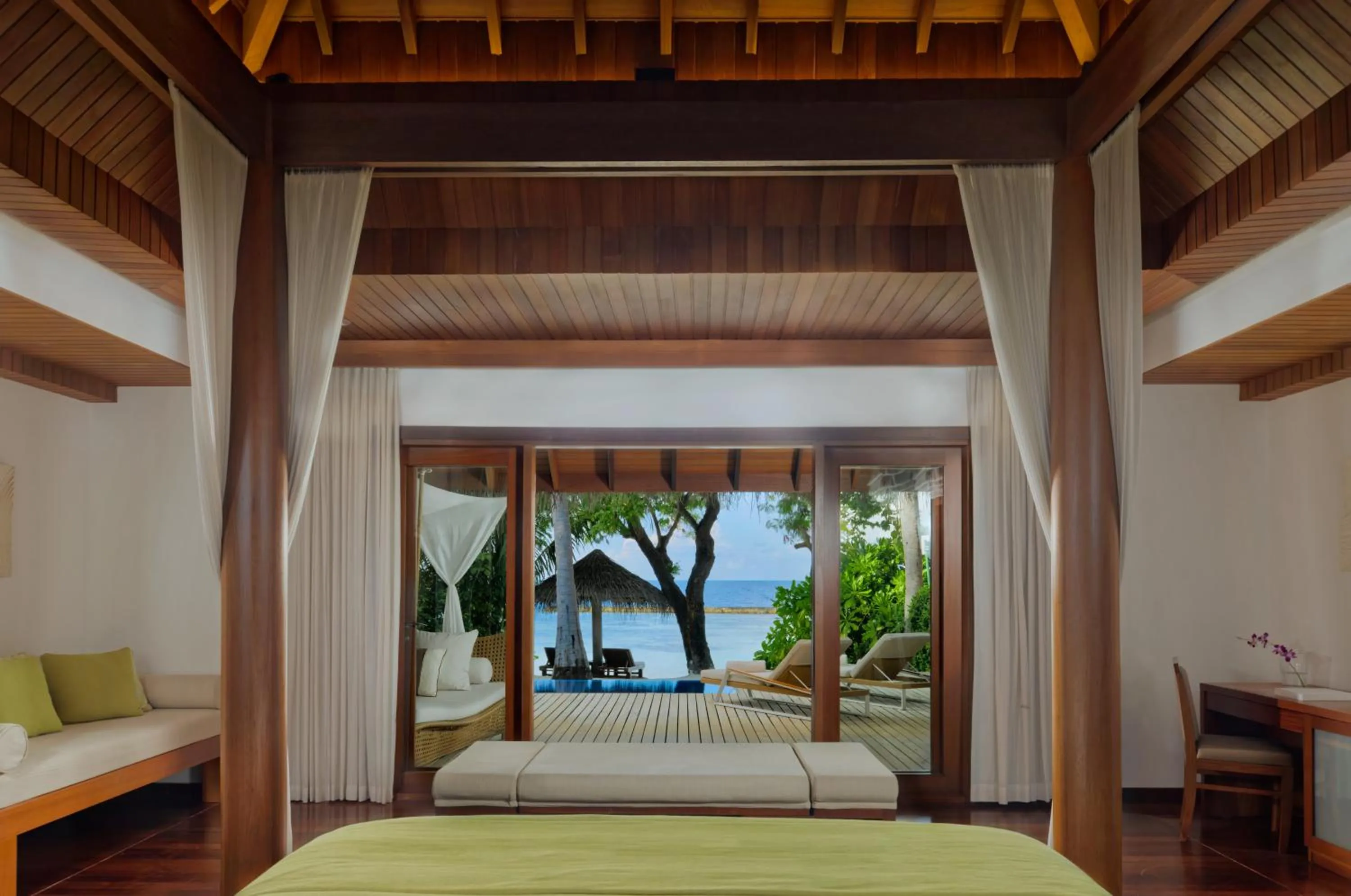 Bed in Baros Maldives