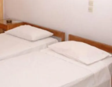 Bed in Poseidon Hotel