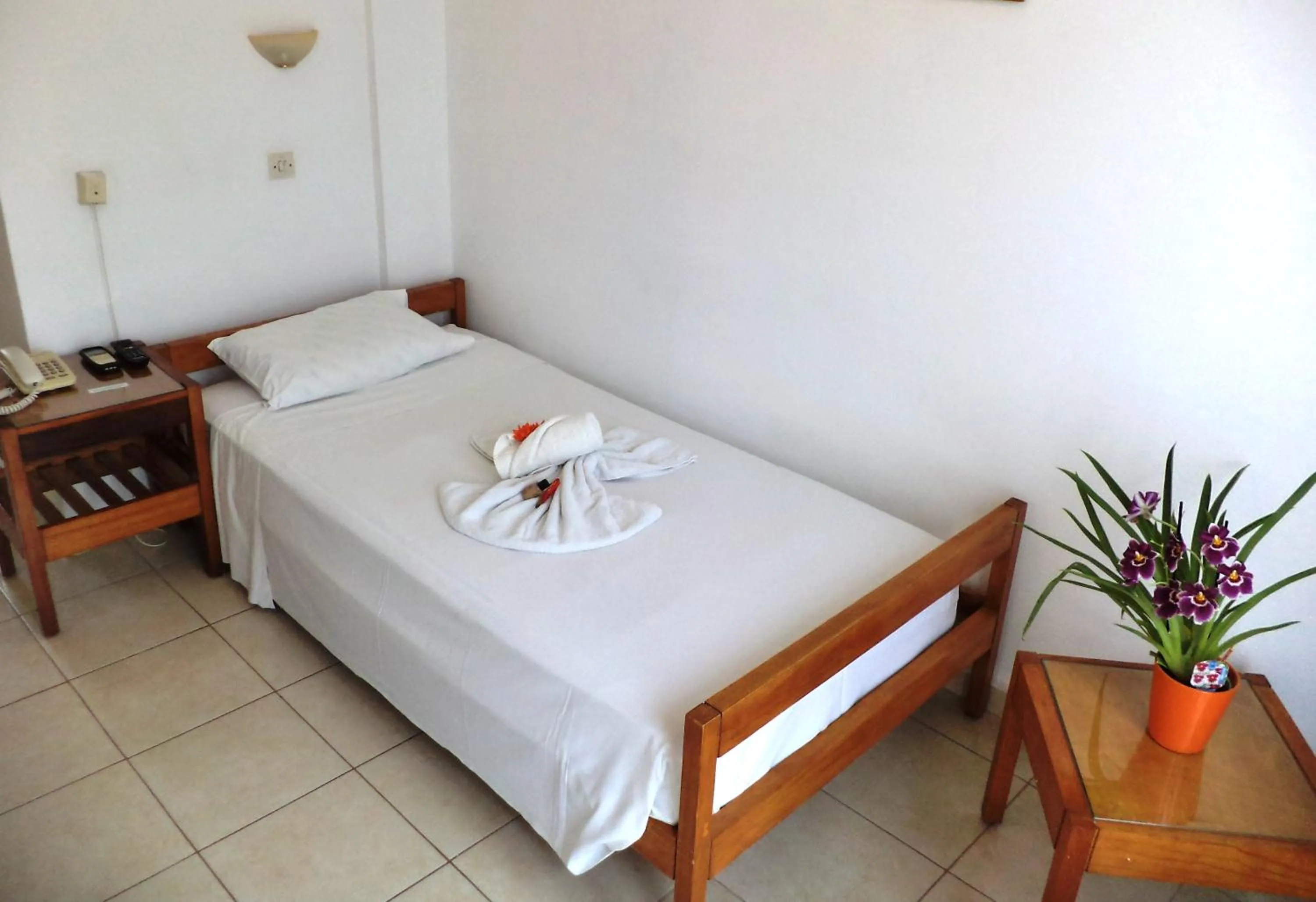 Bed in Poseidon Hotel