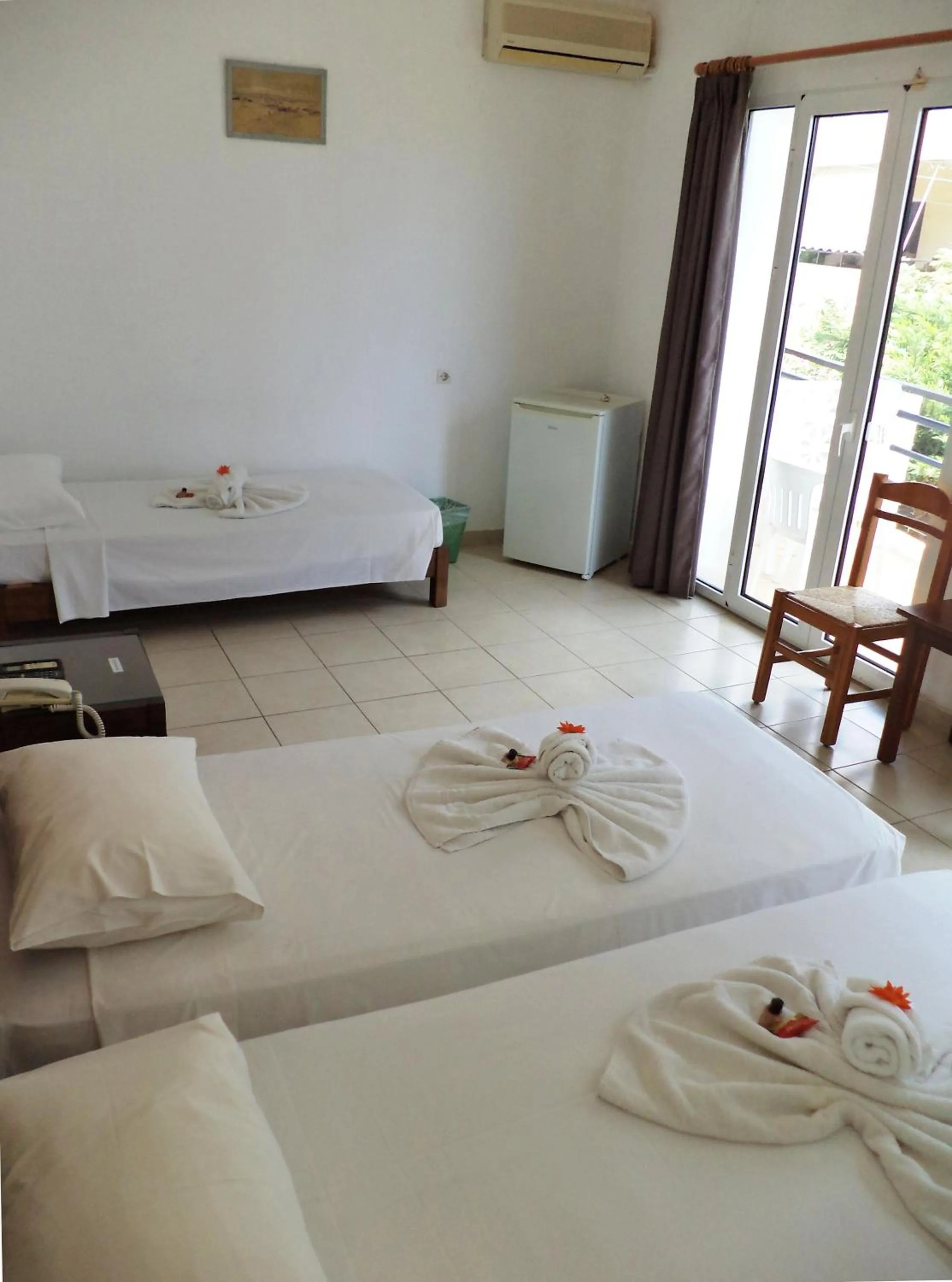 Bed in Poseidon Hotel