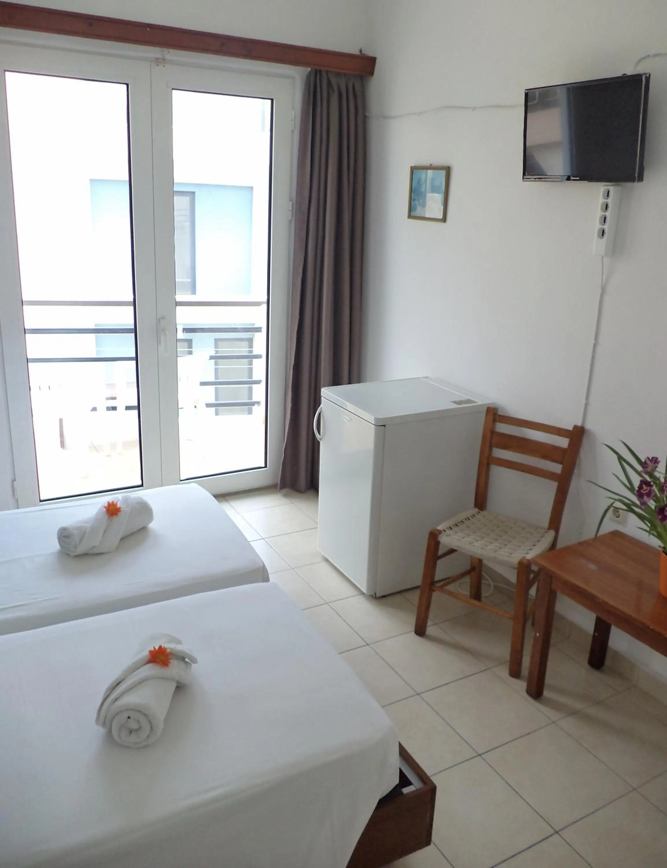 Bed in Poseidon Hotel