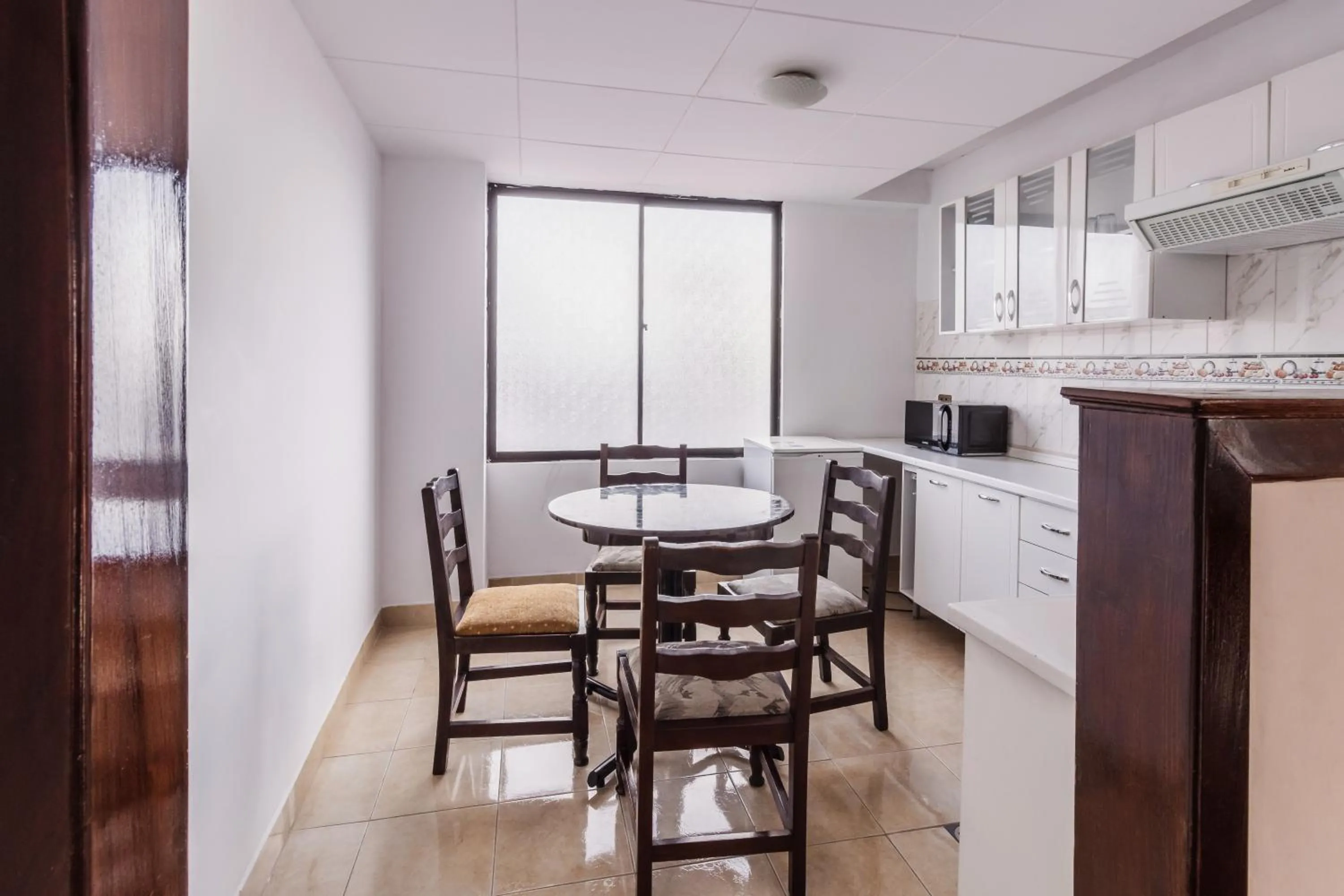 Kitchen or kitchenette in Elegance Hotel