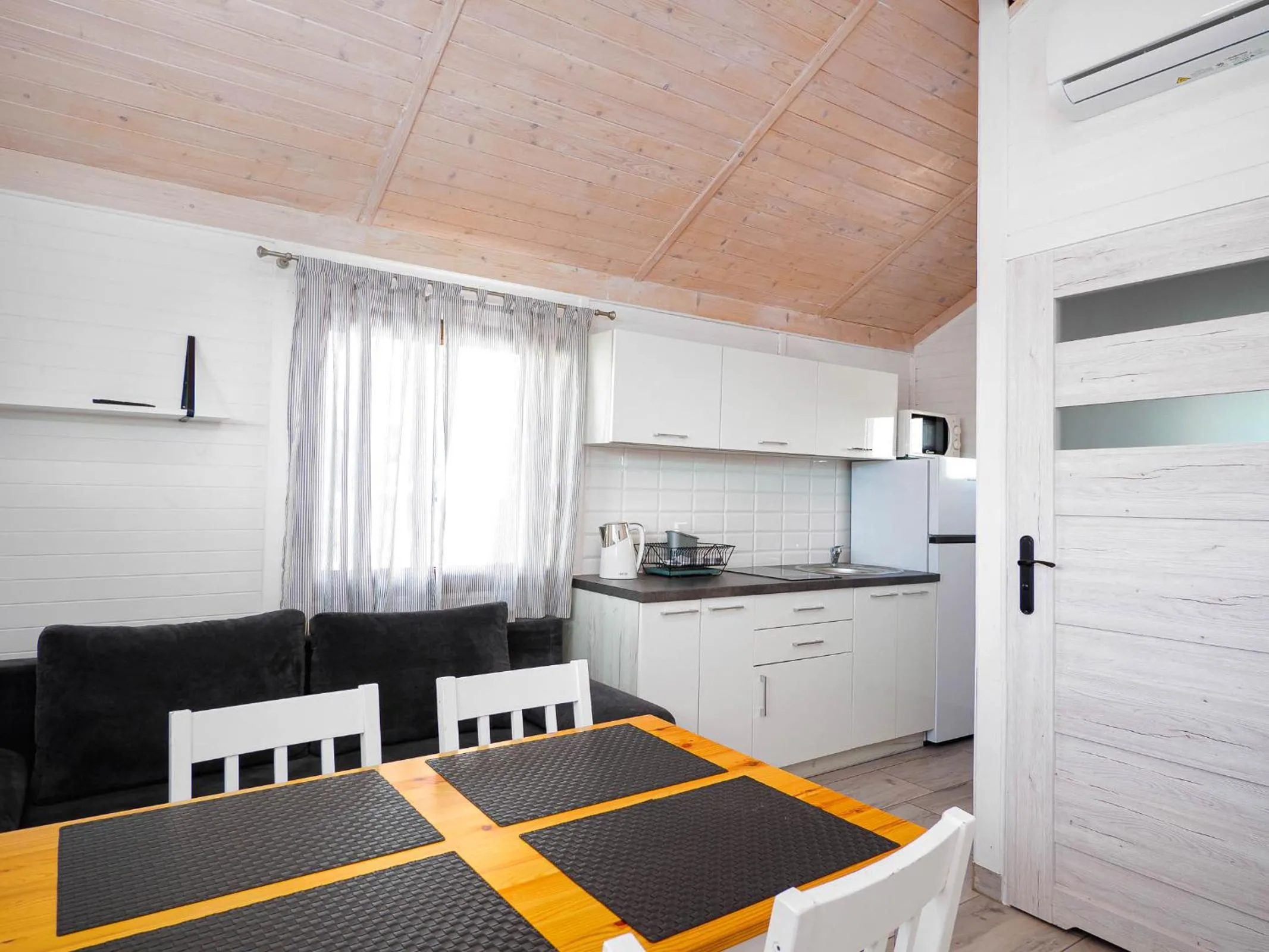 Kitchen or kitchenette in Domki Alan Jarosławiec