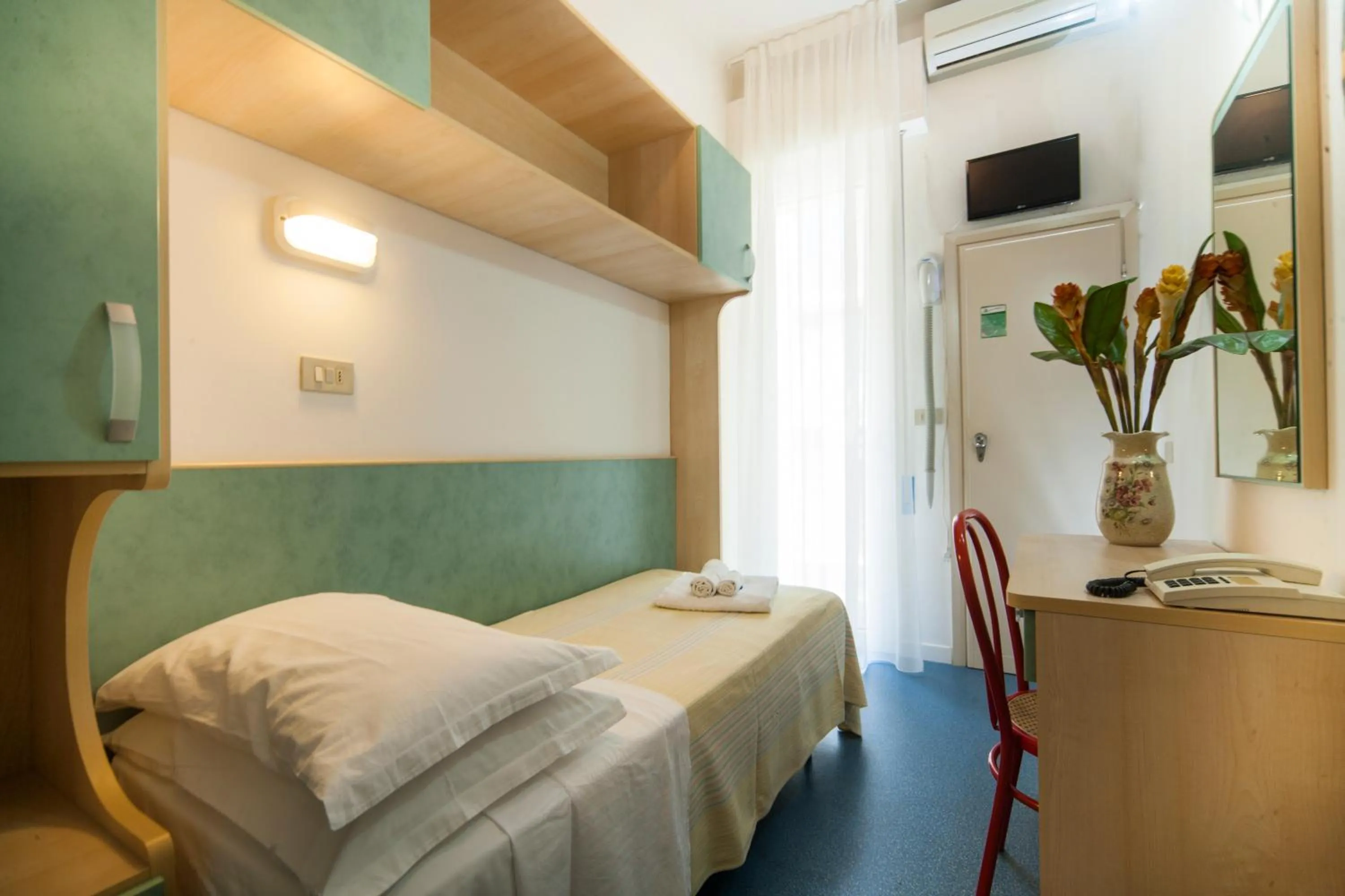 Bed in Hotel Erika