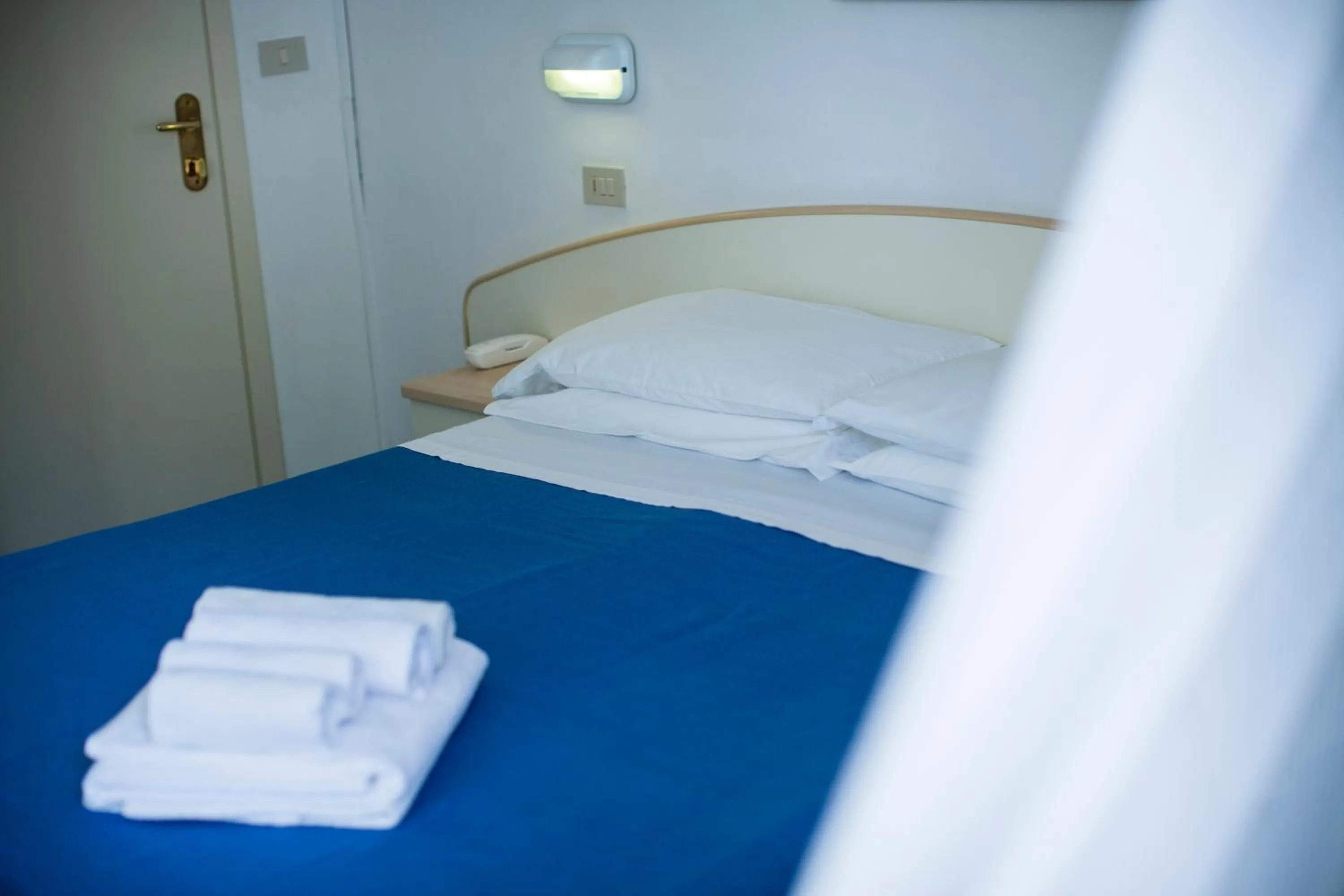 Bed in Hotel Erika