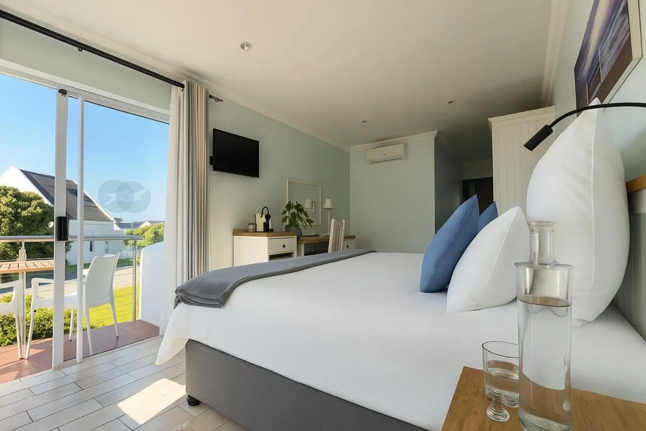 Bed in BlueSky Arniston Guest House