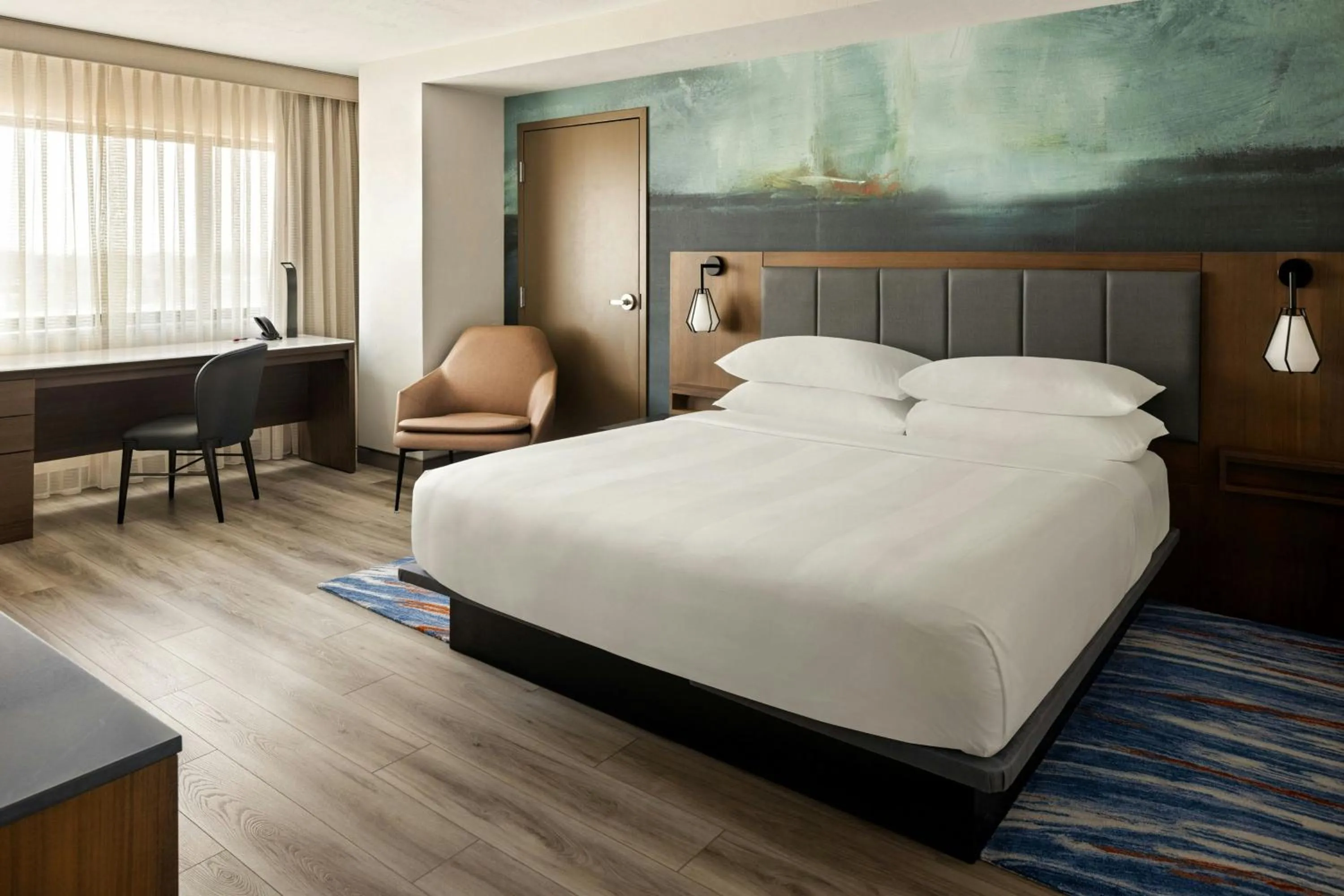 Photo of the whole room, Bed in Oshkosh Marriott Waterfront Hotel & Convention Center