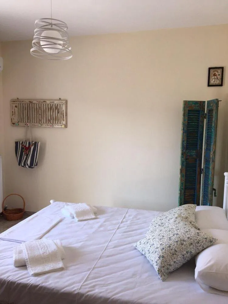Photo of the whole room, Bed in Christina Apartment