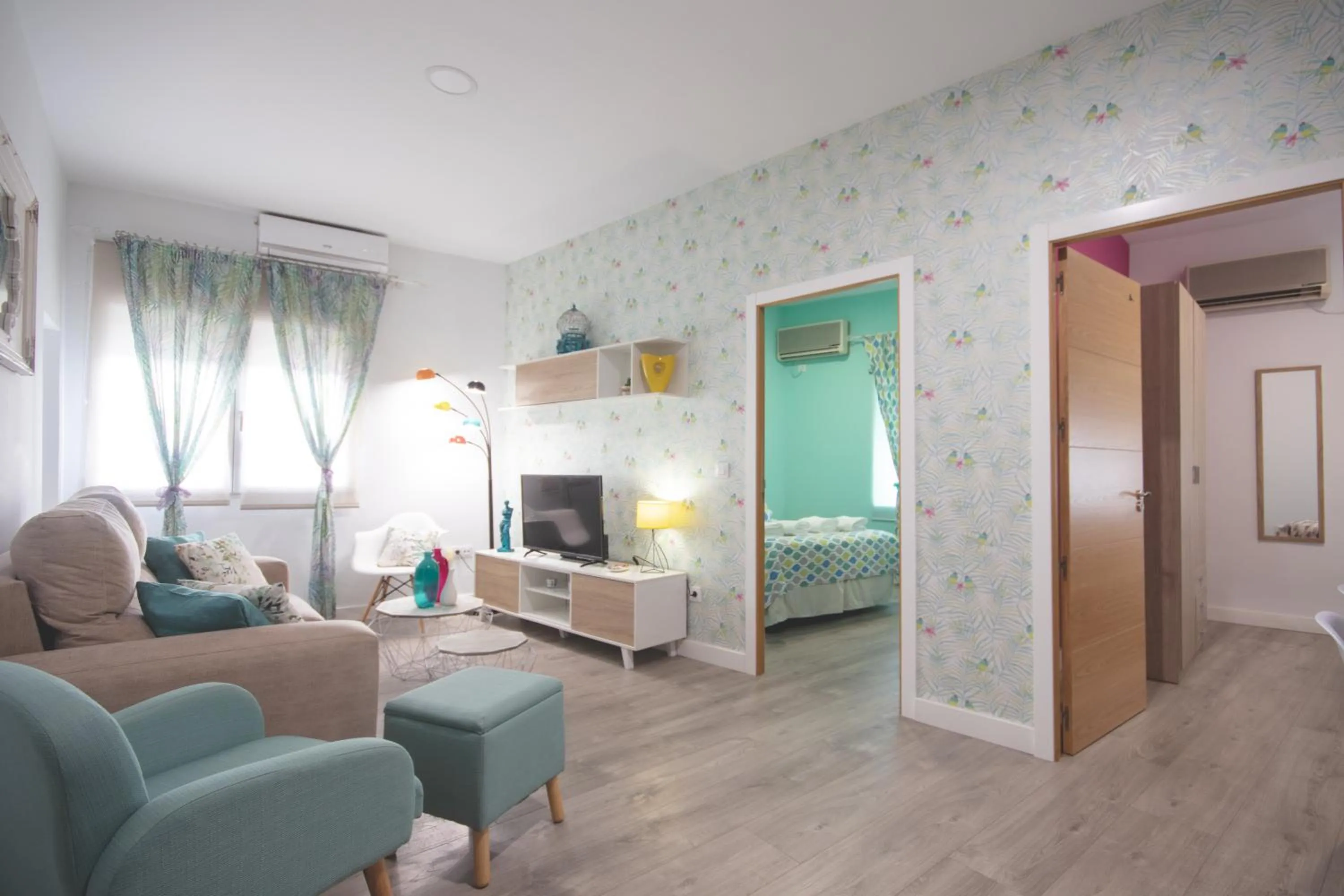 Living room, Bed in Apartamentos Coso de San Albin