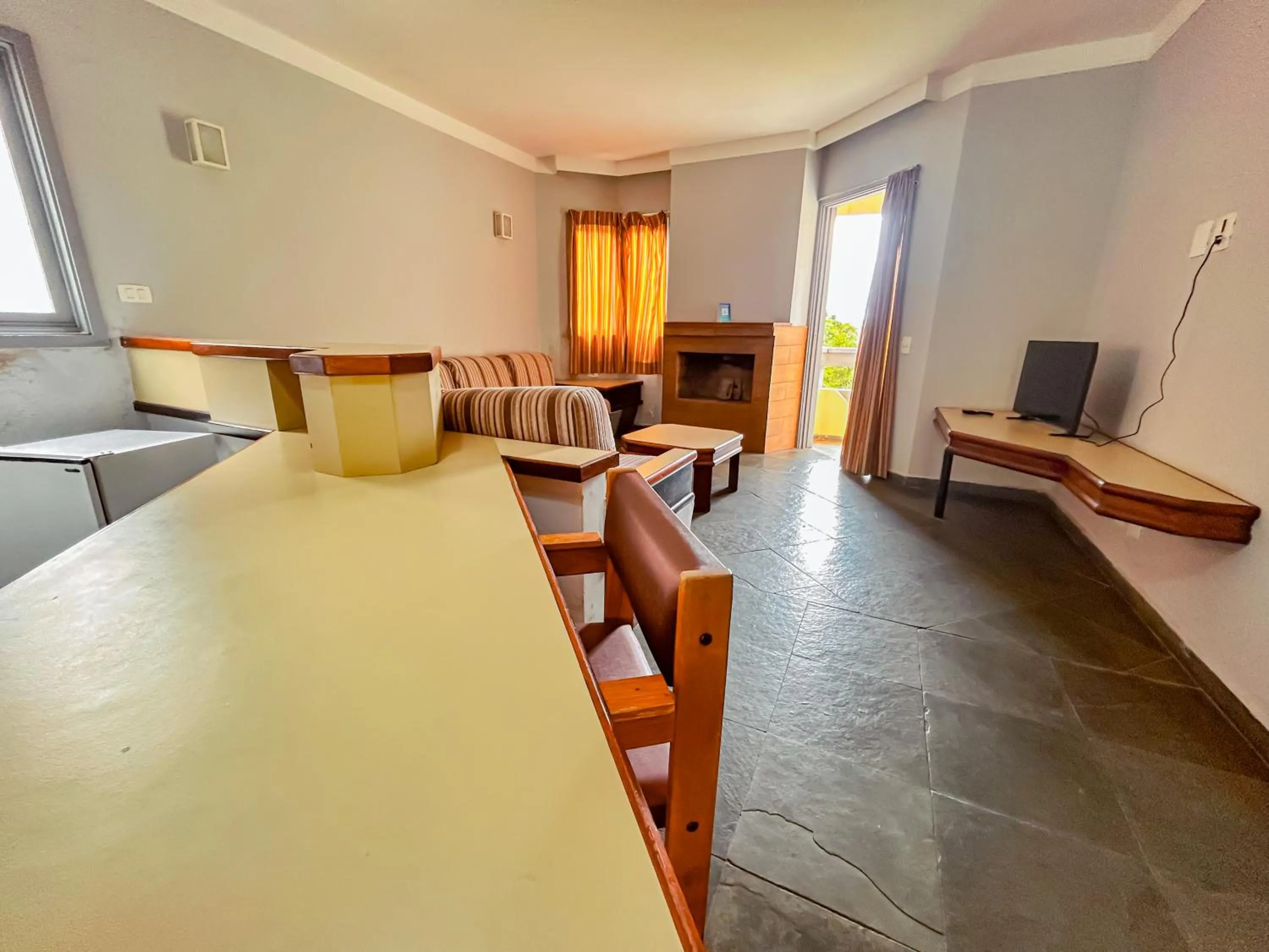 Living room, Bed in Plaza Inn Week Inn