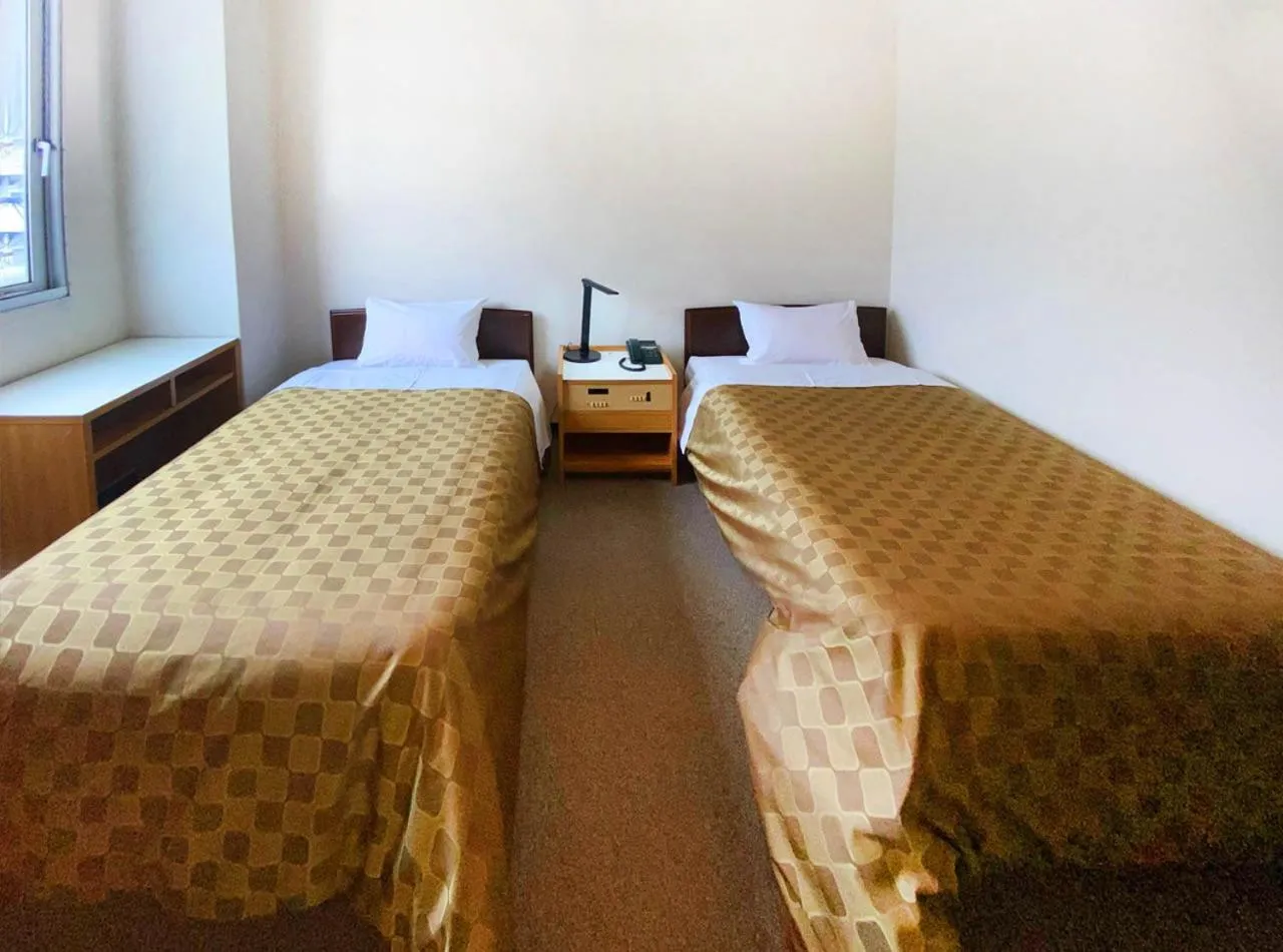 Photo of the whole room, Bed in Hotel Okuni (Royal Inn Group)