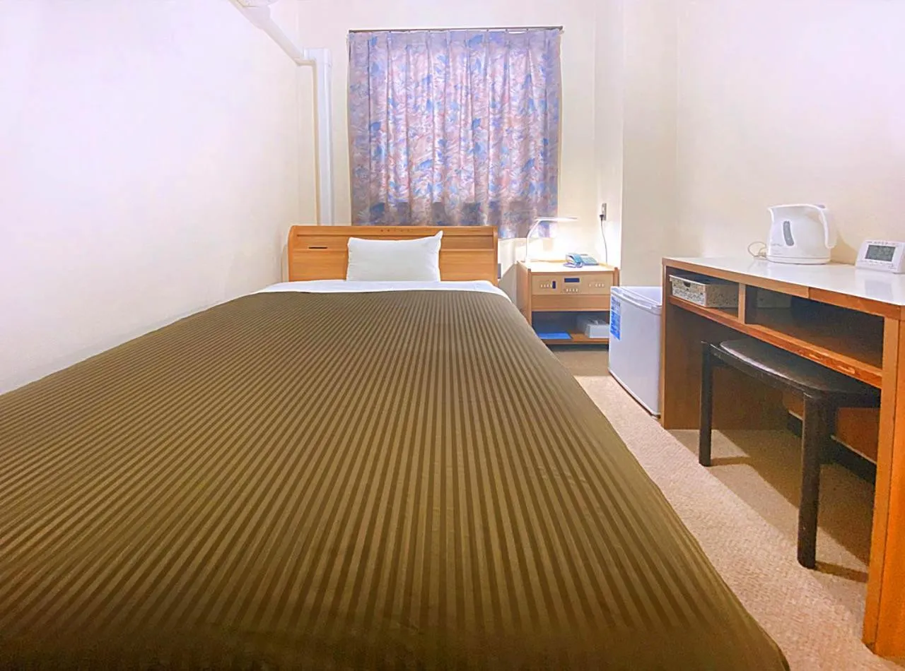 Photo of the whole room, Bed in Hotel Okuni (Royal Inn Group)