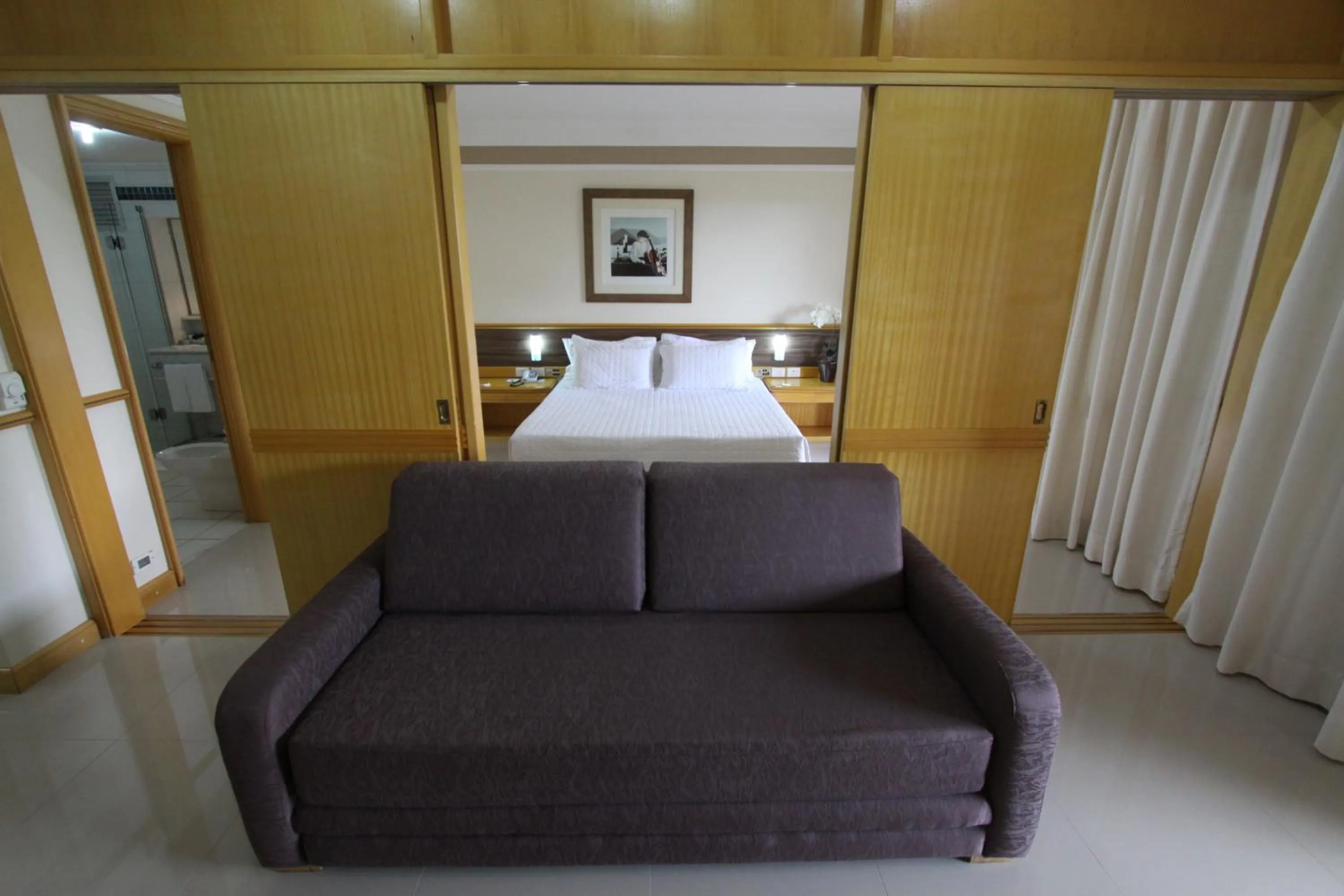 Living room, Bed in Hotel Michelangelo