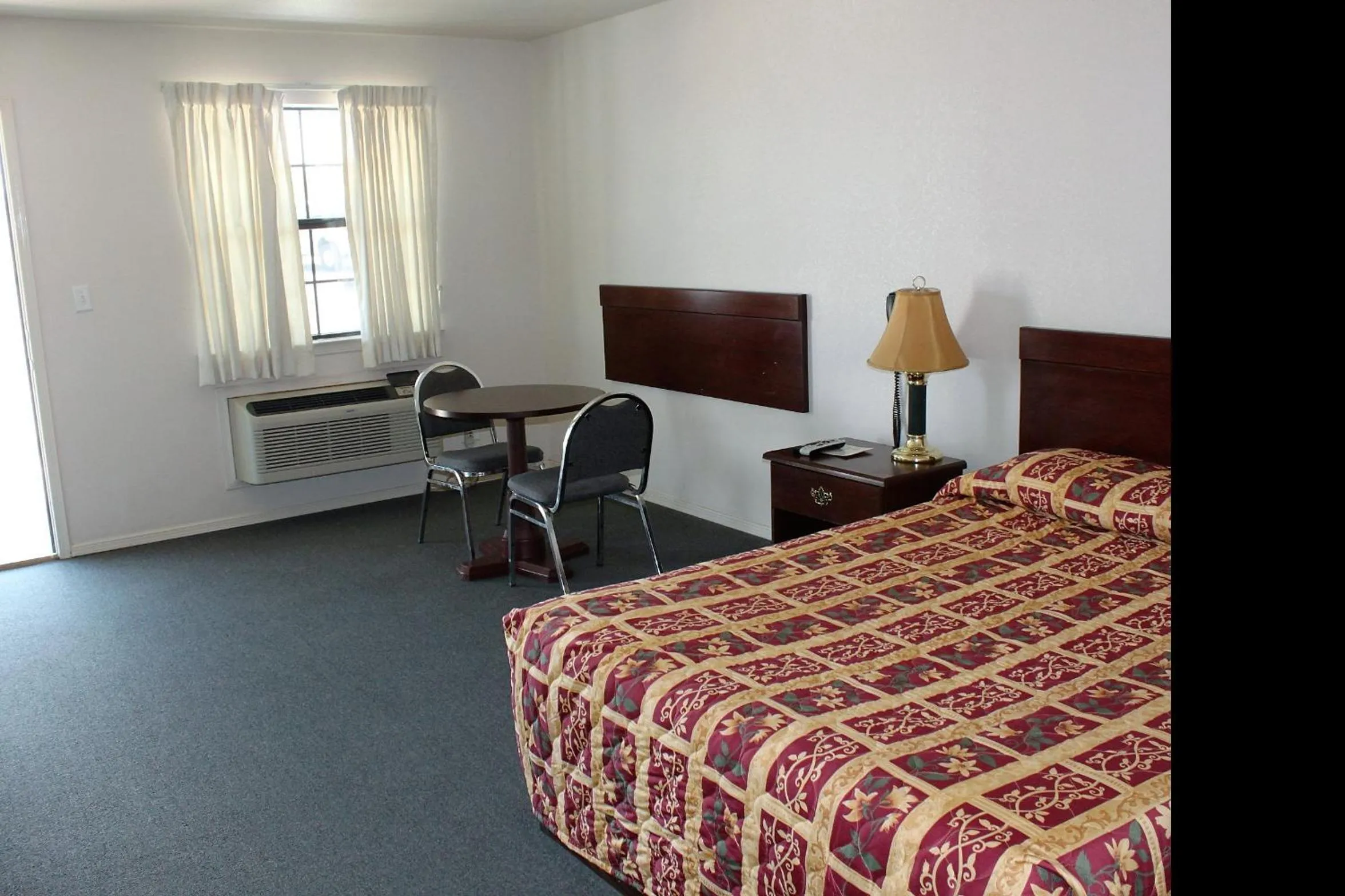 Bed in Adobe Inn Motel