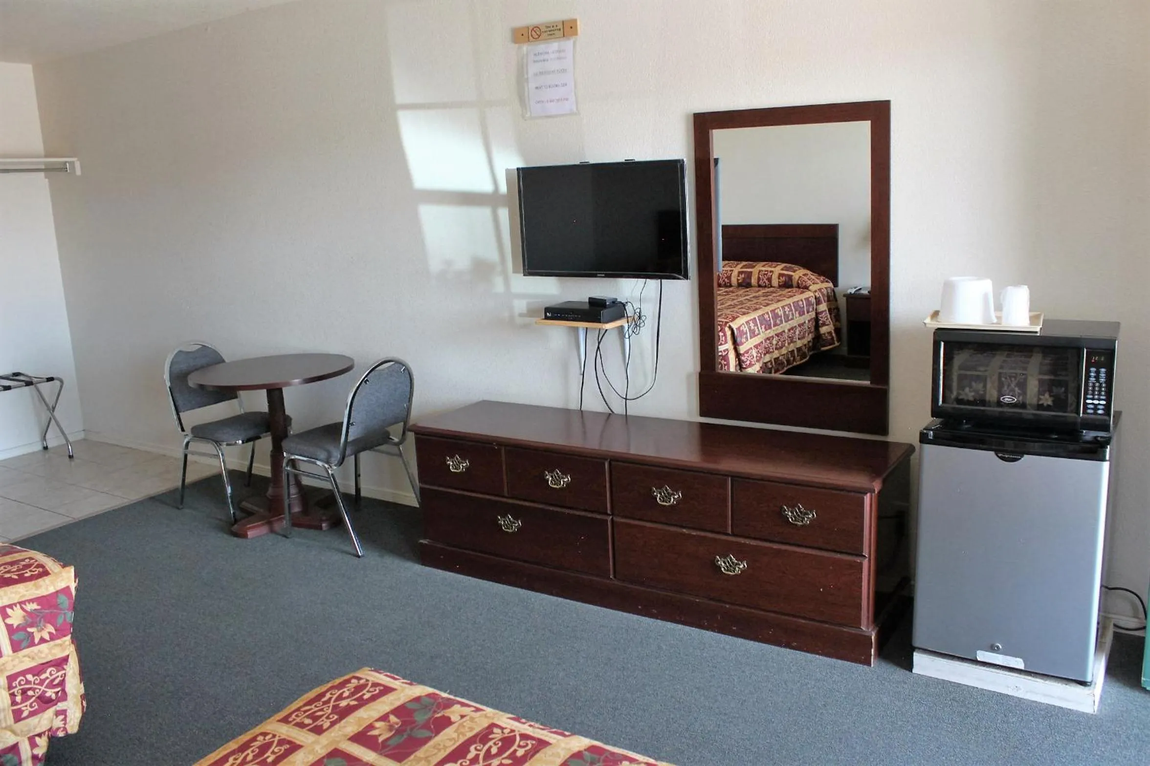 Bed in Adobe Inn Motel