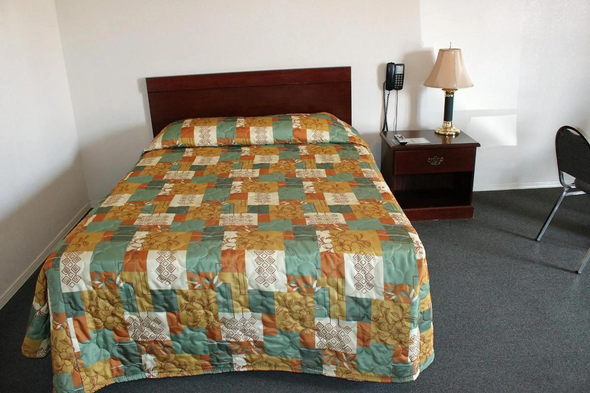 Bed in Adobe Inn Motel