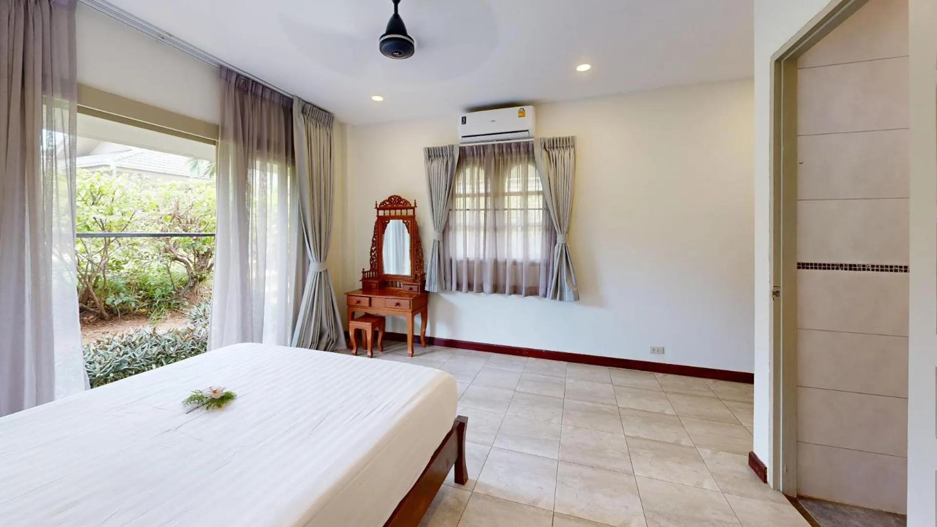 Bed in Idyllic Samui Beach Villa Resort