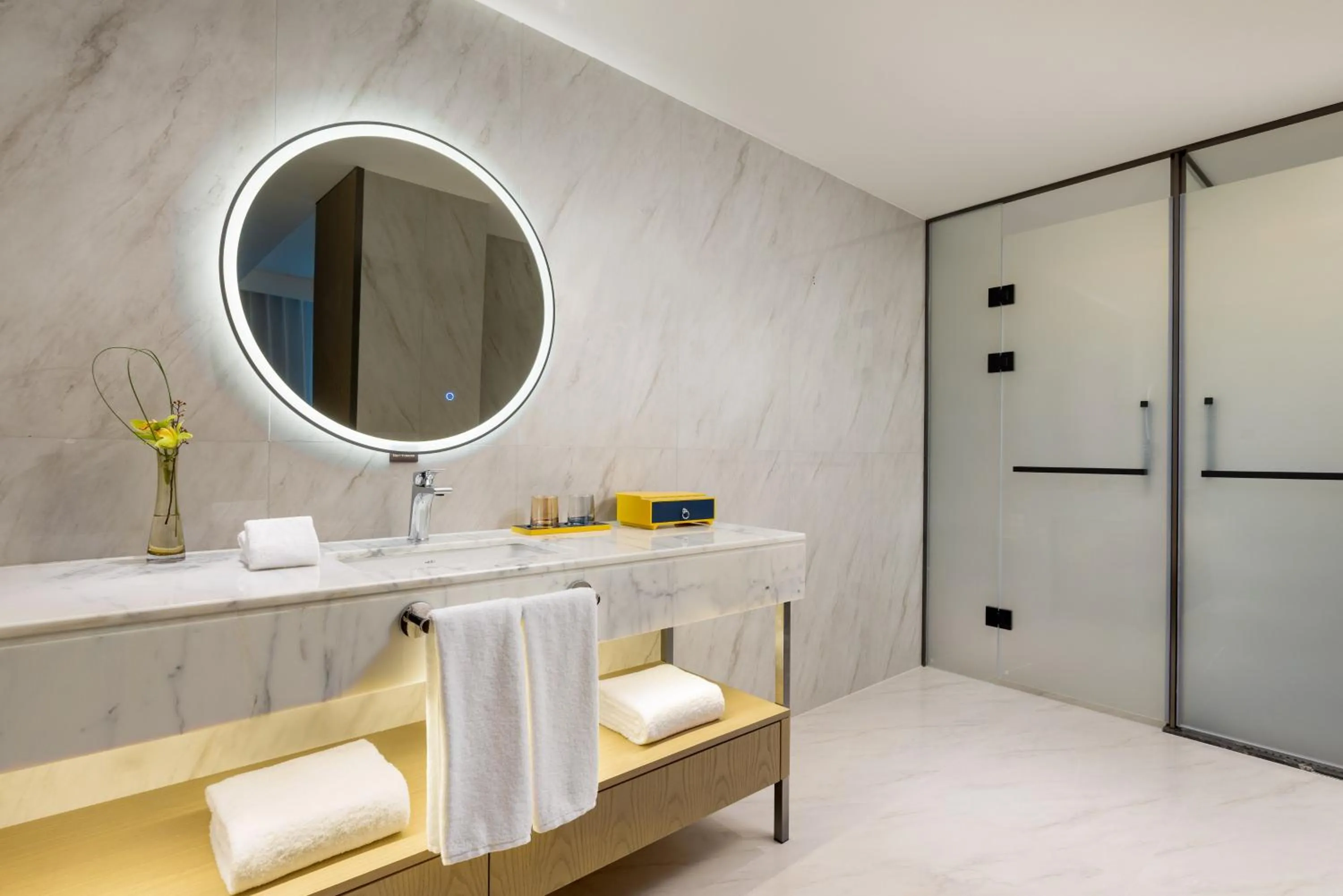 Bathroom in voco Suzhou Guanqian Street by IHG