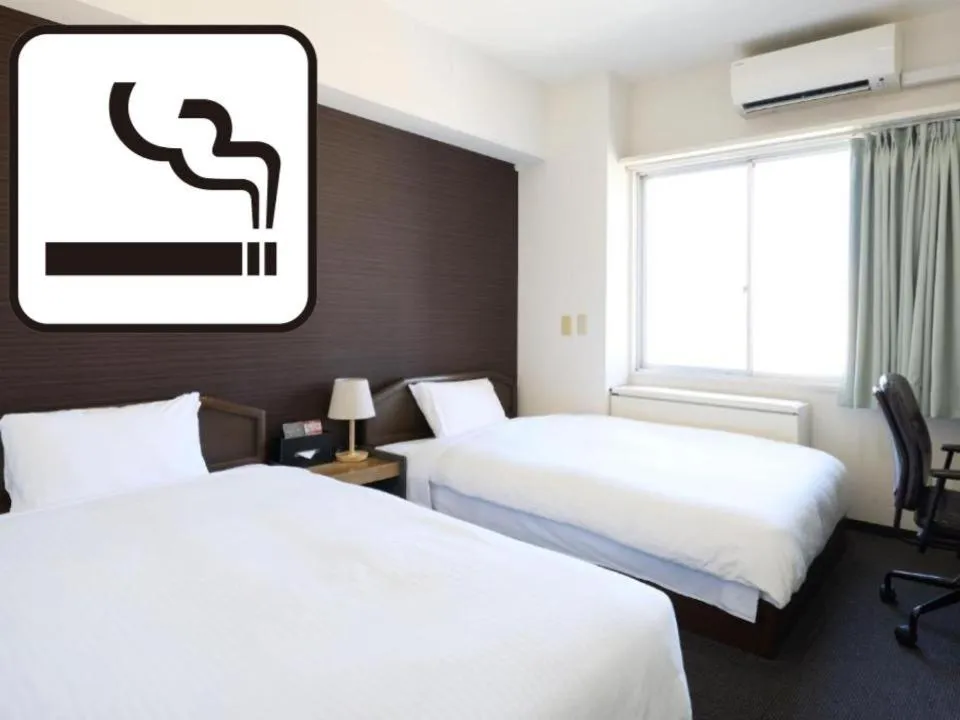 Bed in Tabist HotelArflex Tokuyama Station