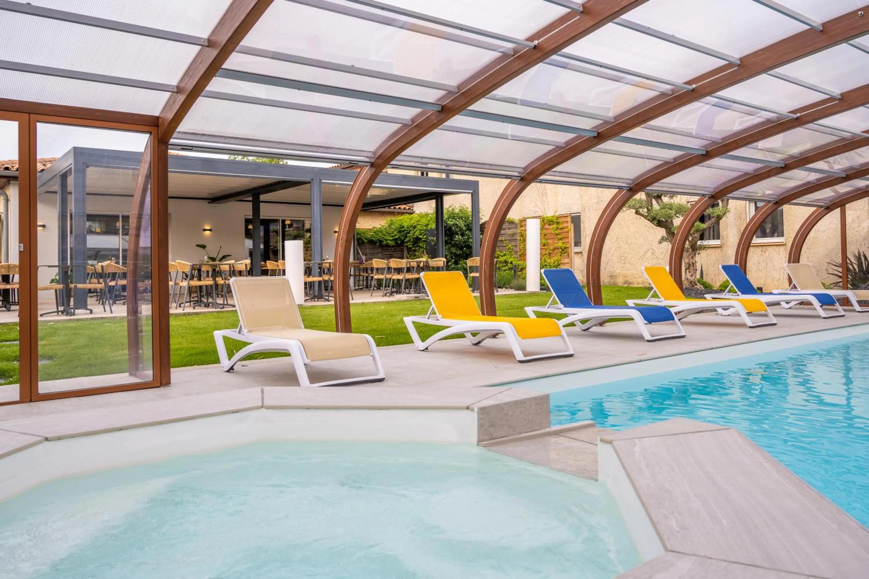 Swimming pool in LOGIS Hôtel Restaurant Le Clos Fleuri