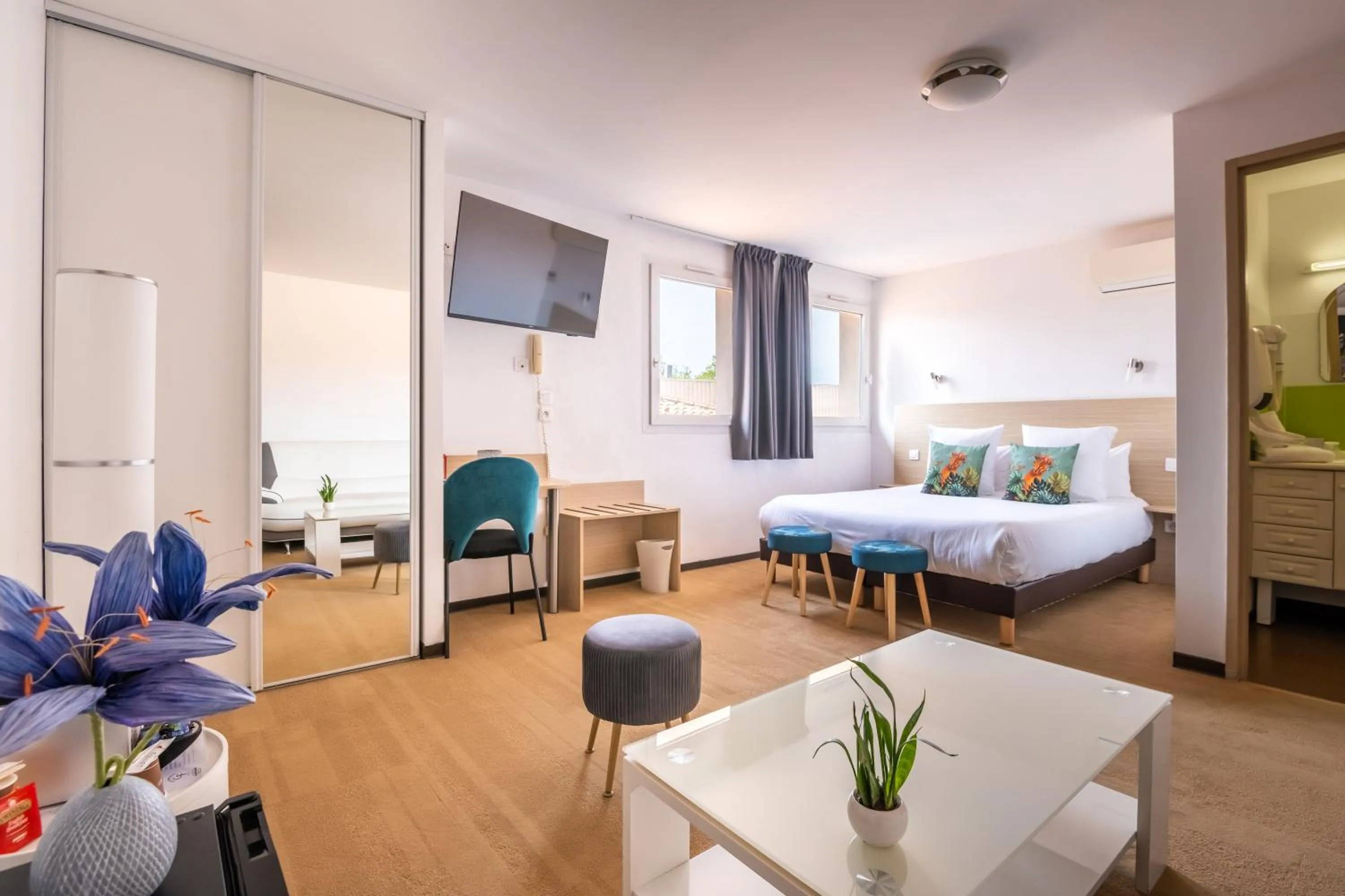 Photo of the whole room, Bed in LOGIS Hôtel Restaurant Le Clos Fleuri