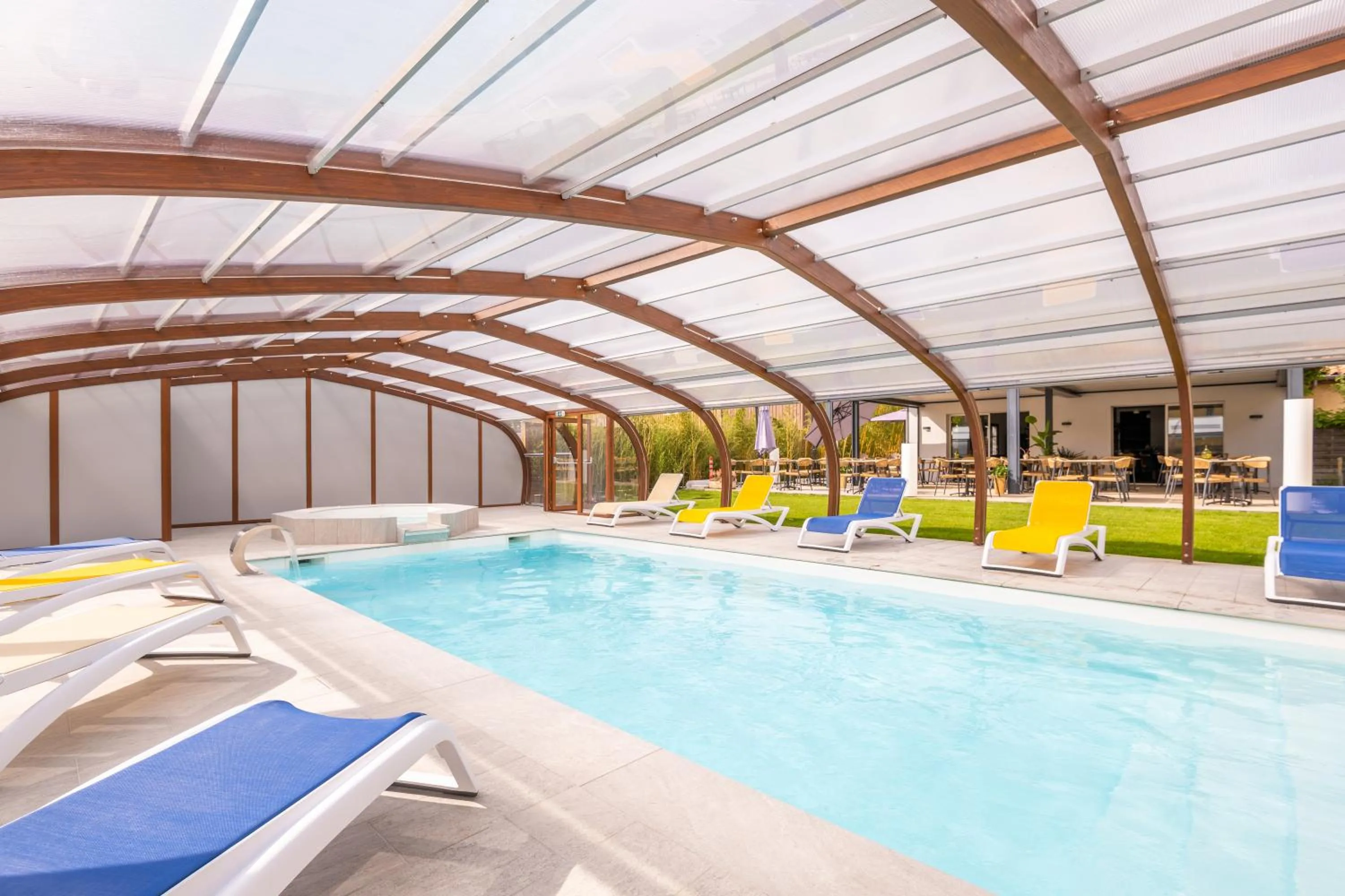 Swimming pool in LOGIS Hôtel Restaurant Le Clos Fleuri