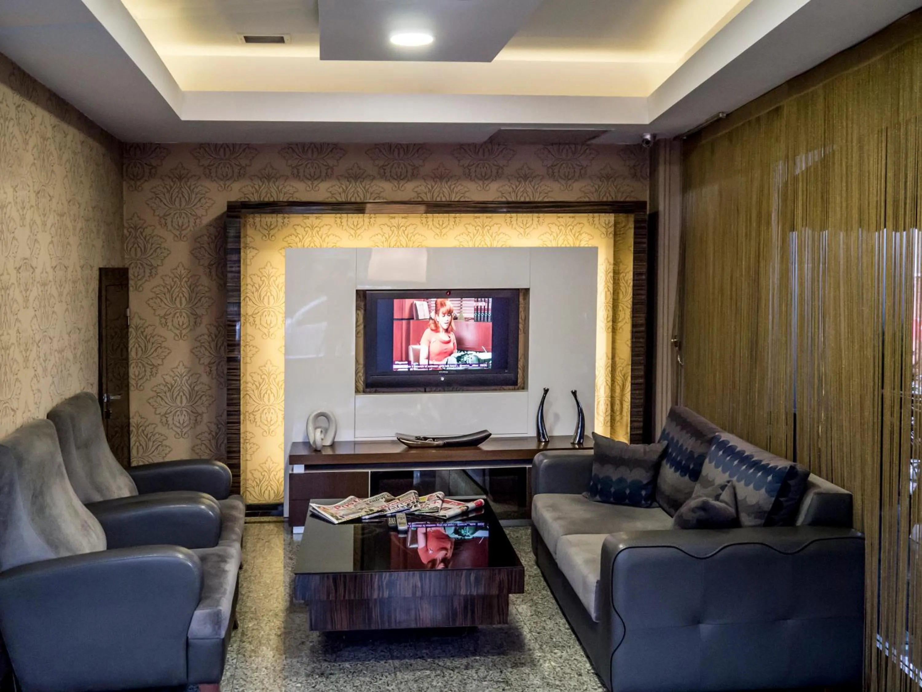 Communal lounge/ TV room in Lioncity Hotel