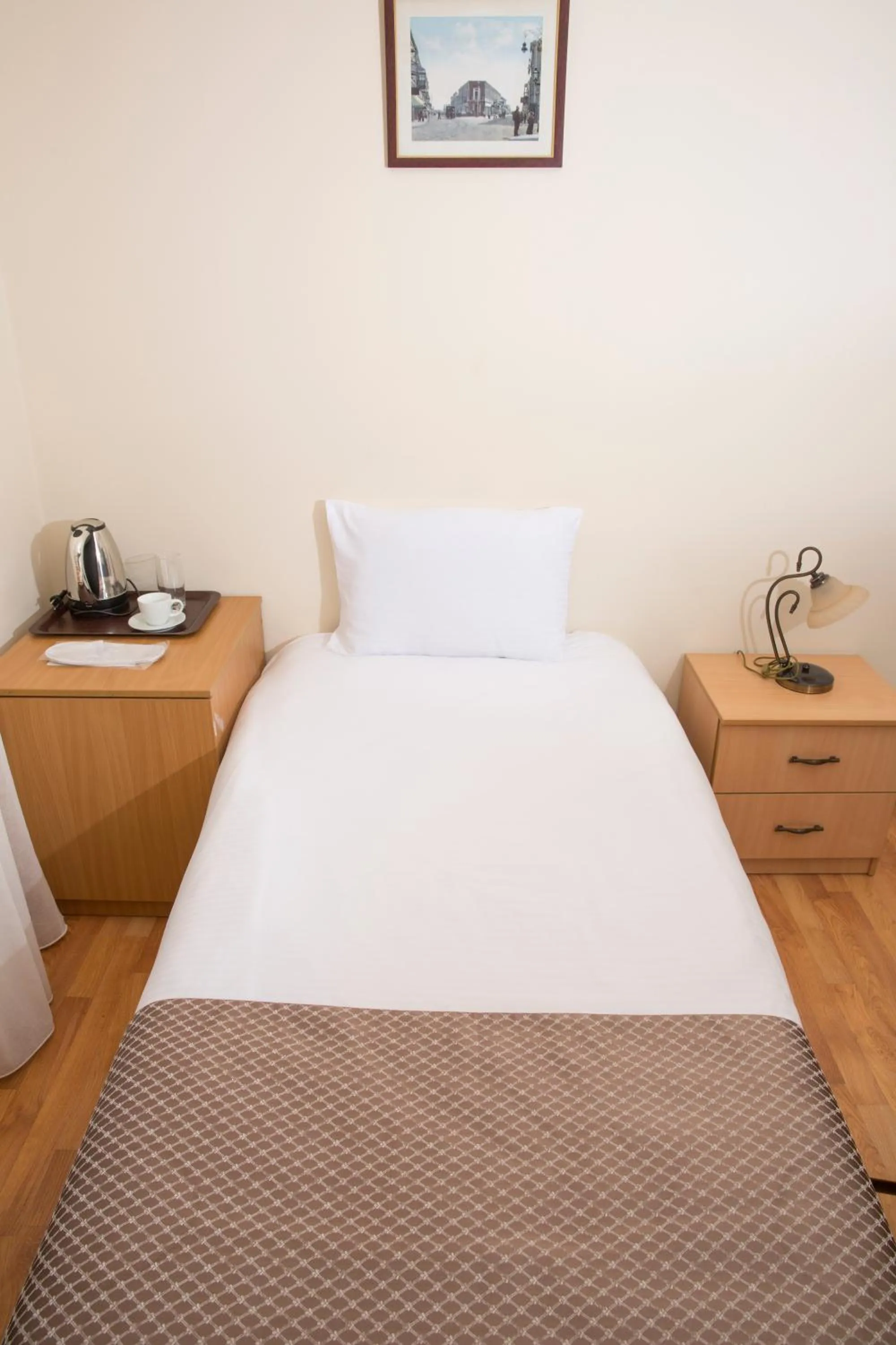 Bed in Old City Inn Hotel