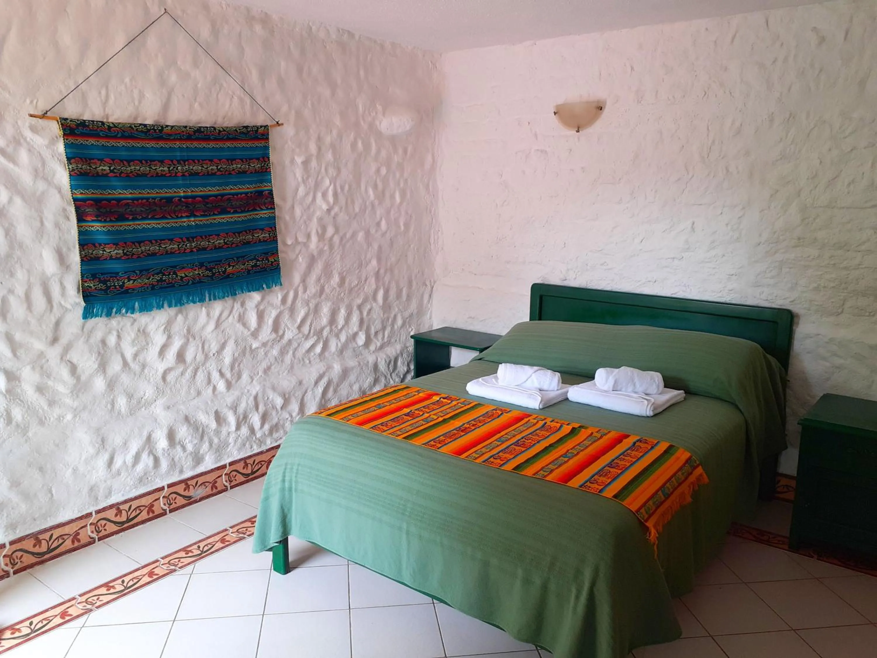 Bed in CasKaffeSu Hotel and Restaurant Mindo