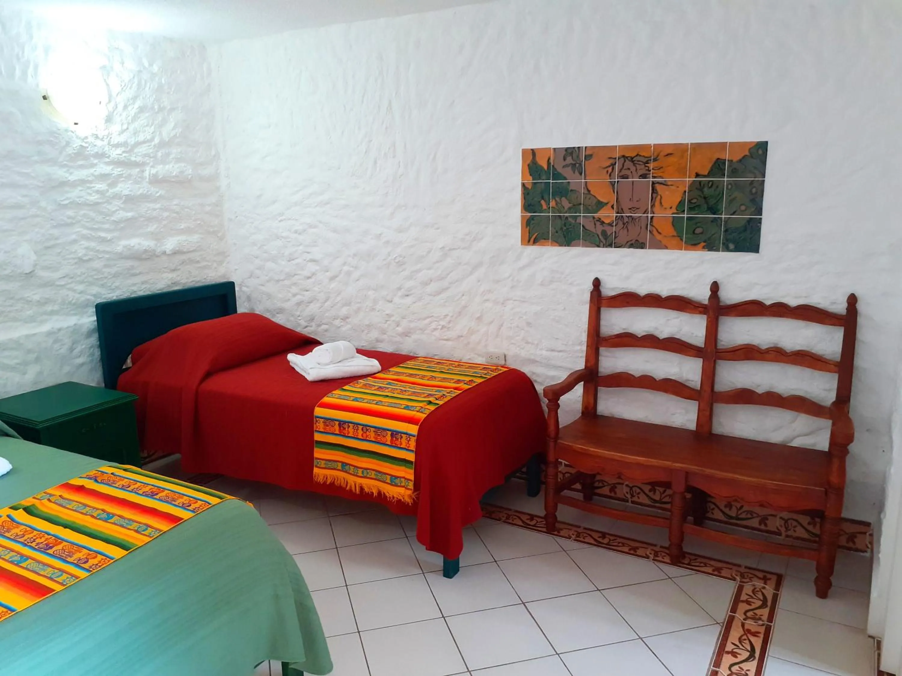 Bed in CasKaffeSu Hotel and Restaurant Mindo