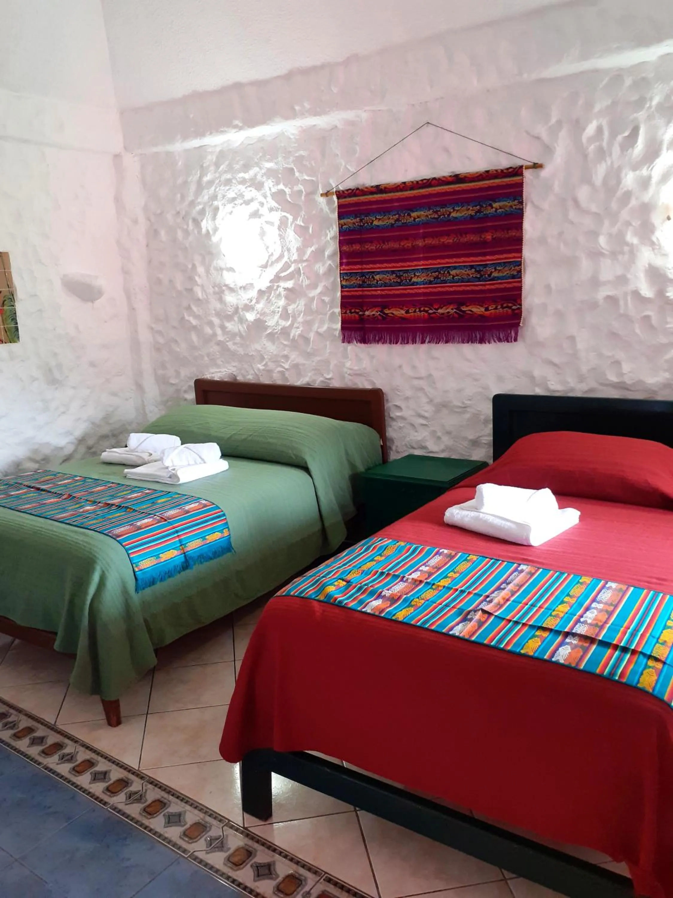 Bed in CasKaffeSu Hotel and Restaurant Mindo